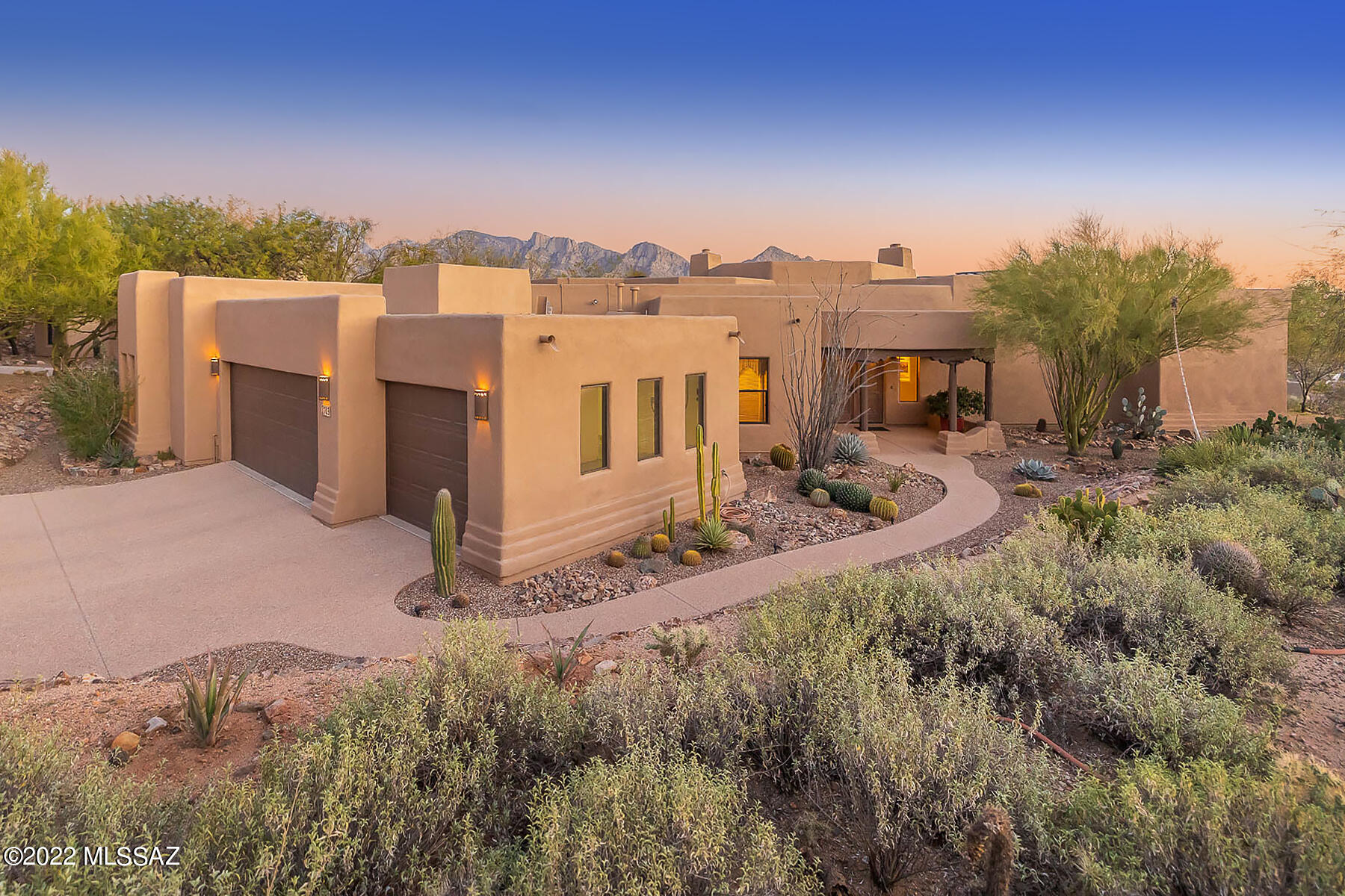 Spectacular 3BD/3BA+Den (3,103 sq ft) half acre estate in the heart of Oro Valley backs to common area boasting resort-style yard and panoramic views. Travertine tile accents the foyer/hallway/great room. Dramatic formal living room is highlighted by soaring, vega beam ceiling, walls of windows & fireplace. Elegant dining room flows to open concept Great room w/gourmet kitchen hosting dual islands, granite counters, Sub-Zero fridge, breakfast bar/nook, beehive fireplace & media center. Den/4th bedroom has murphy bed. Extended Master suite hosts luxury bath w/Travertine, corner jetted tub, tiled walk-in shower and closet built-ins. Bedrooms 2&3 share Jack 'n Jill bath. Owned solar. Sweeping rear veranda w/beam ceiling flows to a heated pool, raised spa w/waterfall and kiva fireplace. Views!