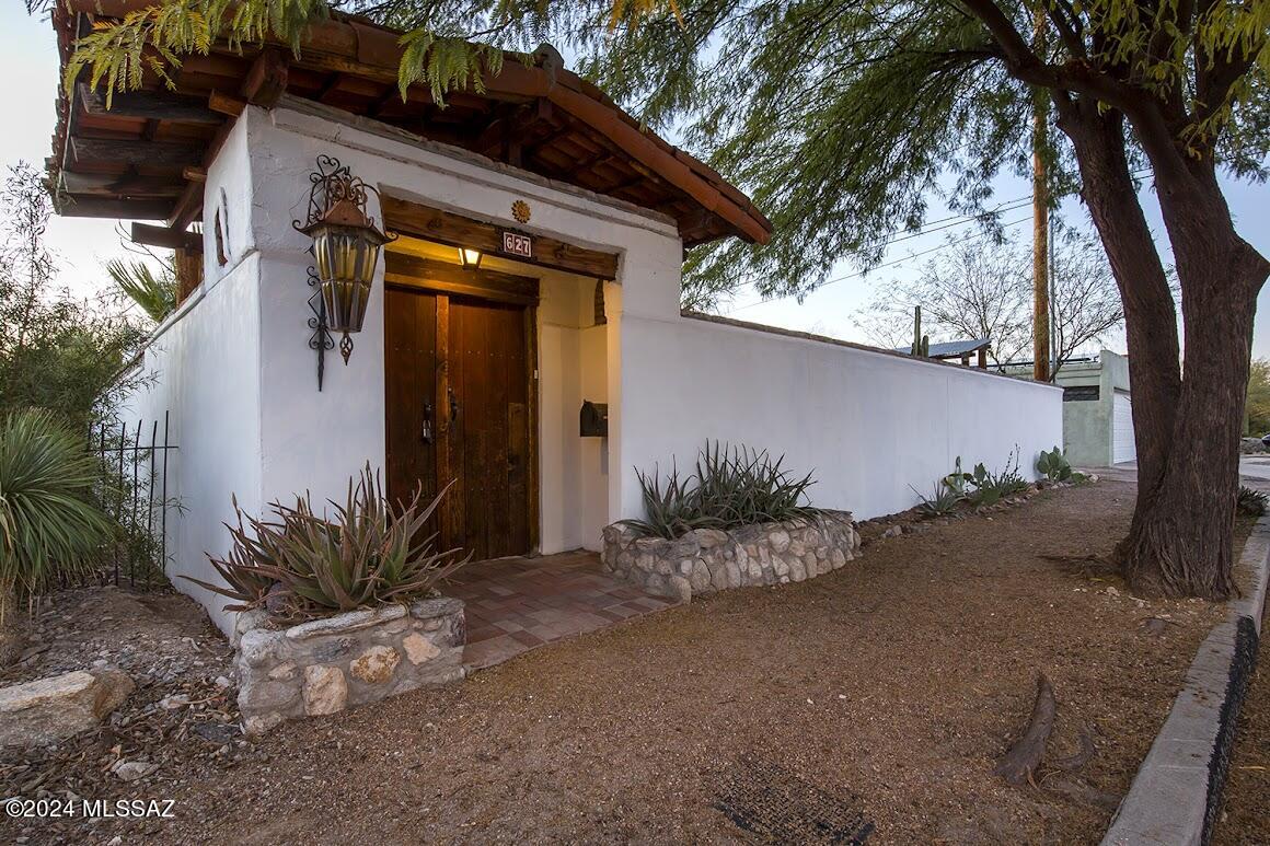 This beautiful Spanish Revival/Santa Fe  home is a Southwest sanctuary like no other.  It has brilliant natural light,  three bedrooms, 2 baths, 10 foot ceilings, exposed viga beams, huge views from its rooftop deck, a large 2 car garage, owned solar electric panels and solar water heater. It's surrounded by a privacy wall, with  outdoor living courtyards front and back that create a true oasis. Located in an excellent spot in the heart of the Sam Hughes neighborhood in Tucson, Arizona, it has easy access to central city amenities like the University of Arizona, Himmel Park, Flora's Market, the famous Tumerico restaurant. Other features: historic status,  outdoor shower, ramps to the house in front and back, roll in shower in the hall bathroom, room for a big garden in the far back yard.
