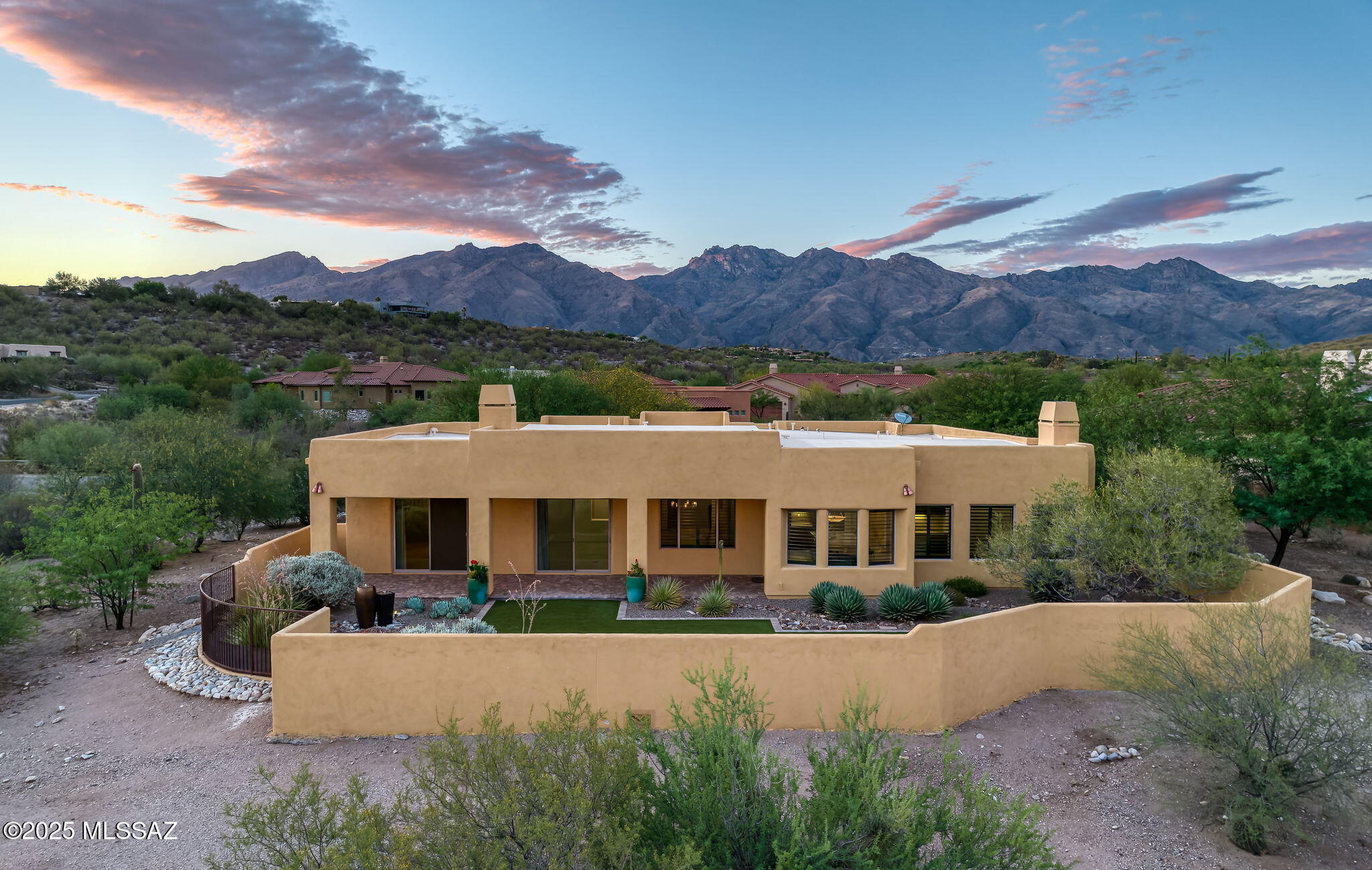 Move in Ready & Meticulously Maintained, 5 BR & 4 BA, Former Model Home in the Private, Ideally Located, 10 Home Enclave of Tanuri Valley w/Mountain & Valley Views. Some of This Homes Fine Feature Include: North/South Orientation, Brick Paver Courtyard Entry - Formal Living & Dining Areas - Modern Island Kitchen w/ Stainless Steel Appliances, Breakfast Area & Bar, All Opening to Great/Family Room w/Gas Fireplace and Built In Desk - Primary Suite w/Gas Fireplace, Two Walk In Closets, & Spa Like Bath w/ Double Vanity, Soaking Tub, & Oversized Shower - Laundry Rm w/ Sink - 3 Car Garage w/ Storage Closets - Spacious Fully Fenced Outdoor Living Area w/ Covered Brick Patio, Synthetic Grass, Water Feature, and Valley Views! Close Proximity To Dining, Shopping, Schools, Hospitals, Hiking, & More!
