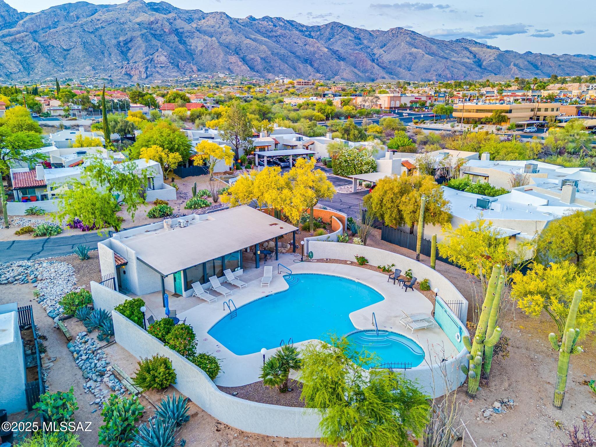 Unbeatable location and size in the Tucson Foothills! This rare 2BR + den, 2BA townhome in La Casita Foothills Estates offers incredible value. Enjoy Tucson's beautiful winter weather from 3 private patios. Features include vaulted plank & beam ceilings, spacious primary suite with walk-in closet & dual sinks, and a flexible den or office. Minutes from La Paloma, La Encantada, a luxury shopping mall, and fantastic dining. HOA includes 2 pools, spa, fire service, trash, and exterior paint. A foothills lifestyle at a price that's hard to beat!