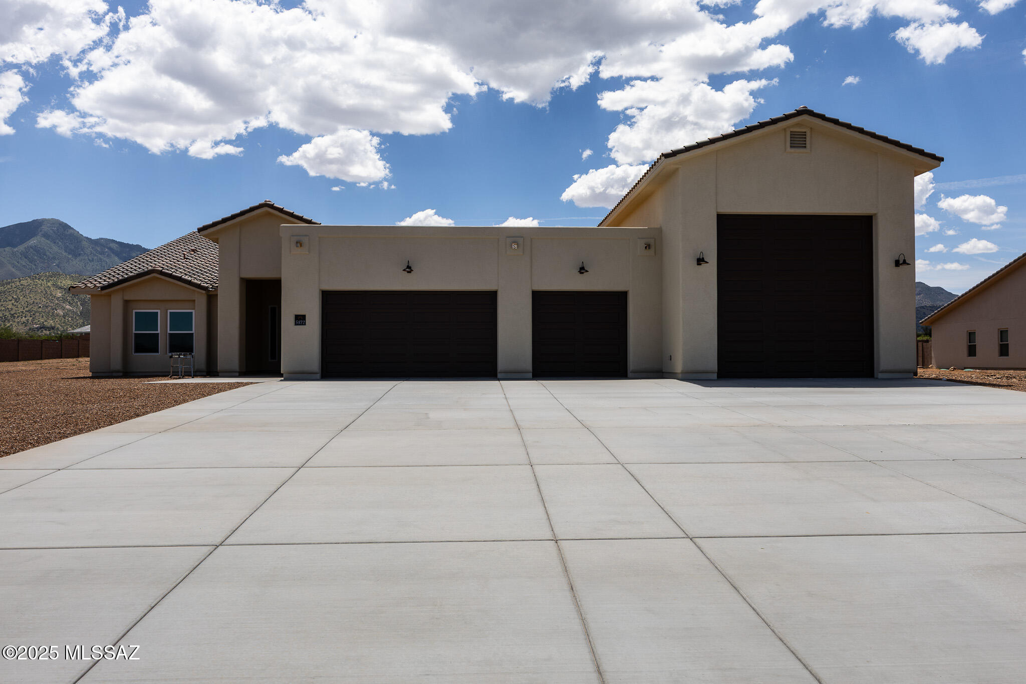 Discover this stunning new home by Sun Canyon Homes in the picturesque Ranchos San Pedro subdivision, Hereford, Arizona. This impressive 4-bedroom, 3-bathroom residence features a spacious sitting room and a 3-car garage with a 4' expansion, complemented by a 20'x40' insulated RV garage. Enjoy breathtaking sunsets from the expansive 10'x60' patio. Culinary enthusiasts will delight in the upgraded kitchen boasting a cooktop, wall ovens, and refrigerator, all accentuated by granite countertops, backsplsh, and an apron front sink. Additional windows throughout the house fill every room with natural light. Experience luxurious living with all-tile floors throughout. Home is under construction.