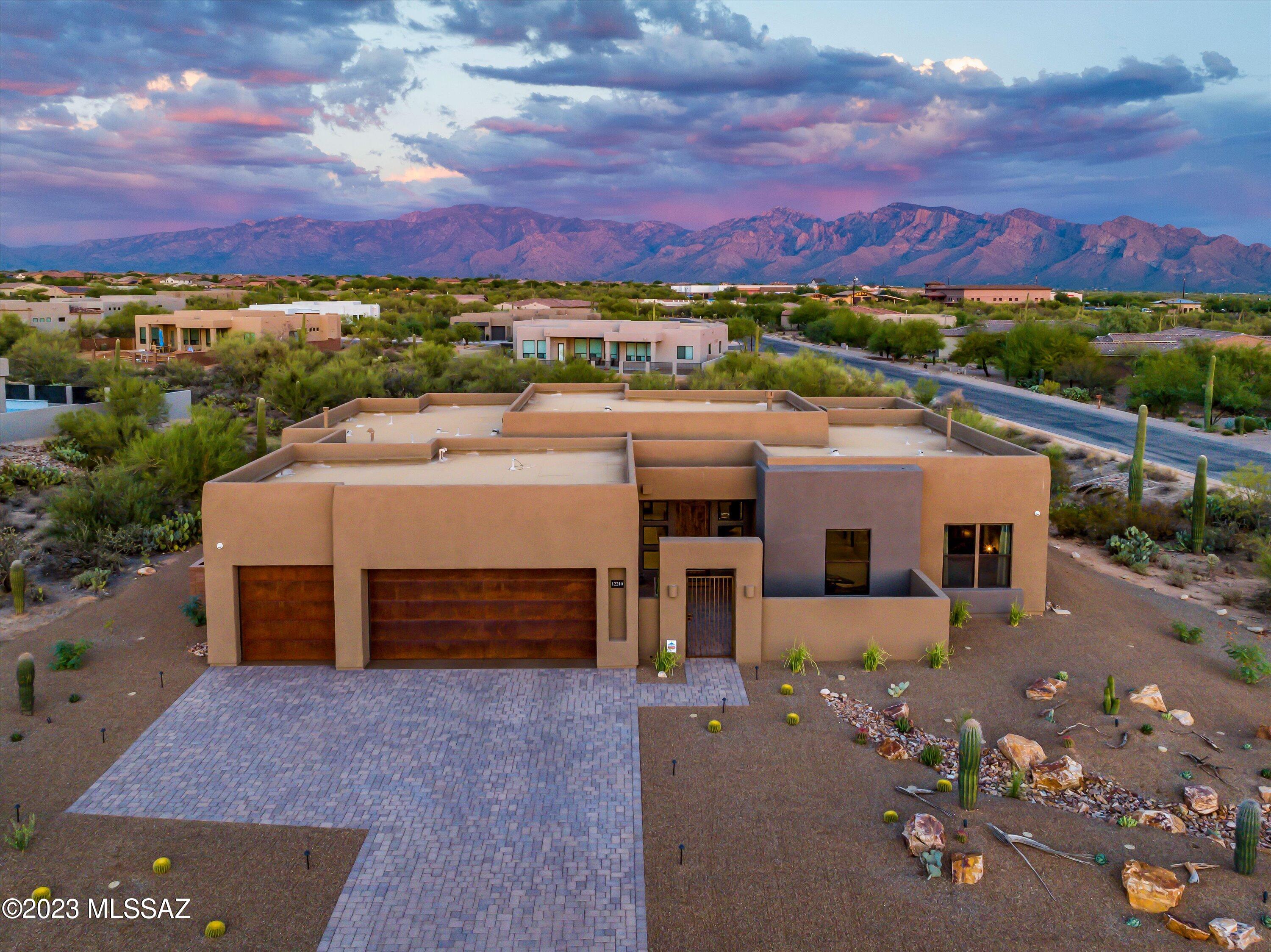 Perhaps you've dreamed of a semi-custom home on a large lot with backyard views of the Catalinas?  Well, dreams do come true-this Prescott floorplan built by Insight Homes in Dec 2022 is in pristine move-in ready condition w/ tasteful upgrades & design finishes.  Situated on .93 acre lot w/ expanded custom designed backyard, 3 br, 2 1/2 bath, den, & 3 car garage.  The kitchen boasts upgraded granite & backsplash, butler's pantry decked out by CA Closets & SS upgraded appliances. Primary BR includes expanded bonus area currently used as work station + large dual closets by CA Closets & upgraded tile walk-in shower.  Water filtration system, 3 ton mini-split in garage, interior insulation for sound control, gas fireplace and so much more. Must see to appreciate