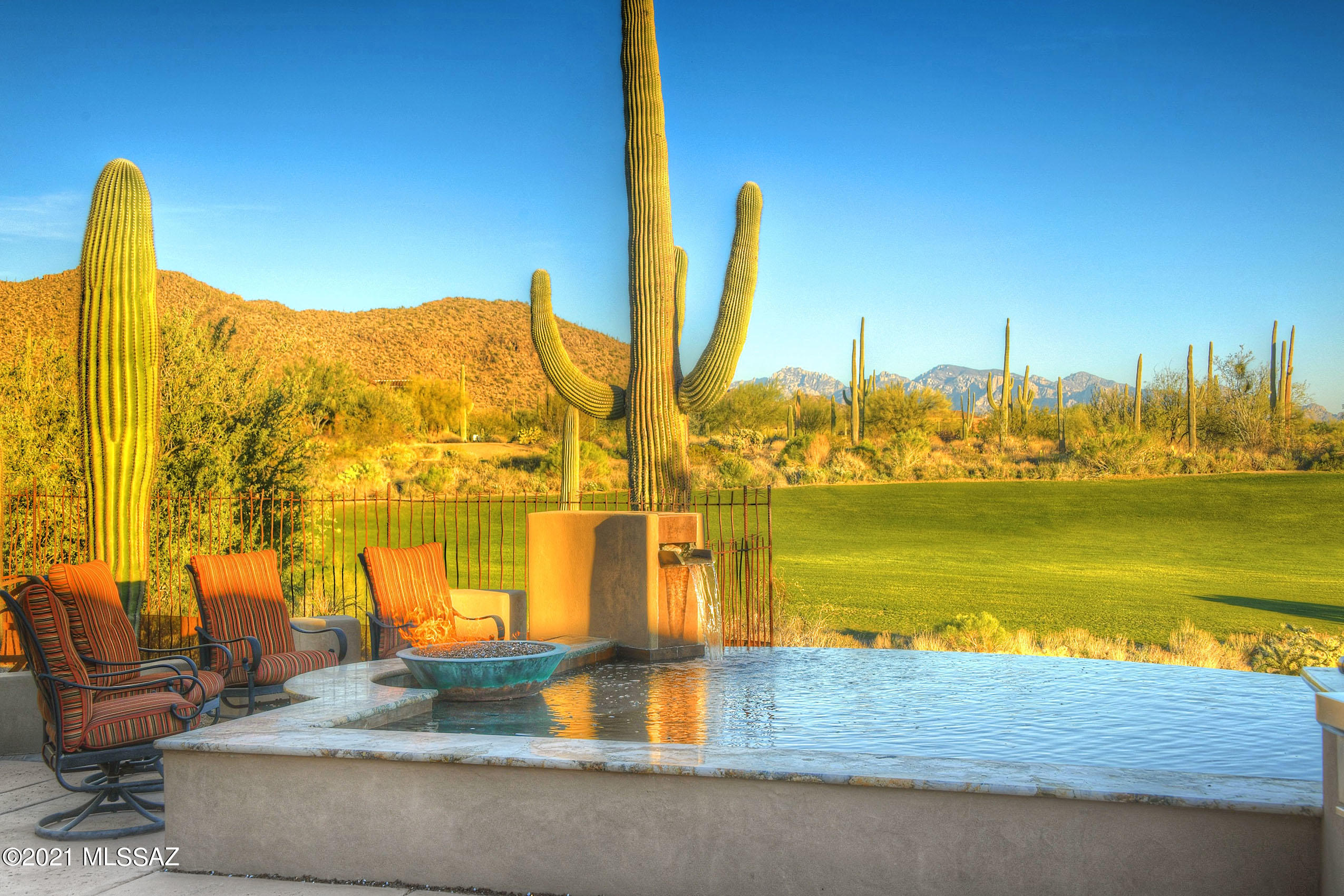 *TASTE OF THE WEST* ENJOY LUXURY AT ITS BEST...RESIDENCES AT RITZ CARLTON IN DOVE MTN! ENJOY ALL THE AMENITIES OF STAYING @ THE HOTEL IN YOUR OWN HOME! FULL CONCIERGE SERVICES, POOL/GYM/SPA/GOLF -5 STAR RESTAURANTS...VACATION AT HOME! AMAZING ESTATE NESTLED IN THE FTHLS OF TORTOLITAS- LOOKS OUT ''JACK NICKLAUS SIGNATURE COURSE'', MAJESTIC MTN RANGES IN EVERY DIRECTION & DAZZLING CITY LIGHTS! WONDERFUL COMBINATION OF CONTEMPORARY FLAIR W ''SOUTHWESTERN TWIST''   BEAMED CEILING, RUSTIC BRICK/TILE ACCENTS, WOOD FLOORS... CREATE A TIMELESS TUCSON TREASURE! HUGE GATHERING RM BOASTS RETRACTABLE GLASS WALL- BRINGING THE SONORAN DESERT  INDOORS! FILLED W/UPGRADES...INFINITY POOL, WATERFALLS, FIREPIT, WRAP AROUND PATIOS, ALL EN-SUITES, OFFICE/4THBR, COURTYD,ENTRY/FOUNTAIN, SUBZERO/WOLF APPLIC & MOR