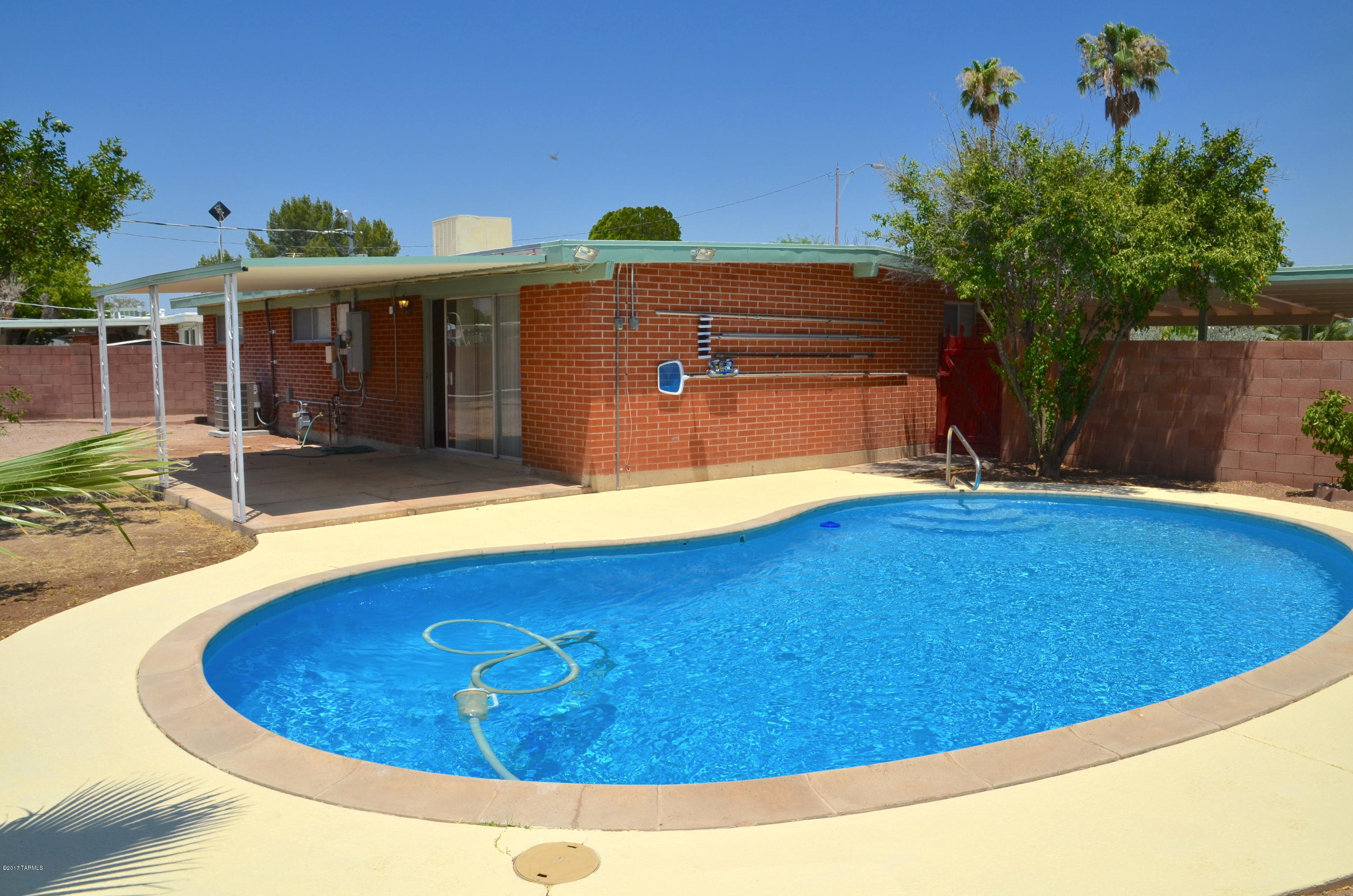 Great remodeled 3br/2ba eastside home w/ a sparkling pool! All new roof, new tile throughout, new kitchen cabinets, new interior doors and hardware, new shower & tub surrounds, updated pool surface and pump/filter, new paint and texture inside, new blinds and more! 200amp electrical added in 2014. Updated HVAC plus dual cooling (Master Cool). Large covered carport. Big backyard with covered patio, pool and room for more.