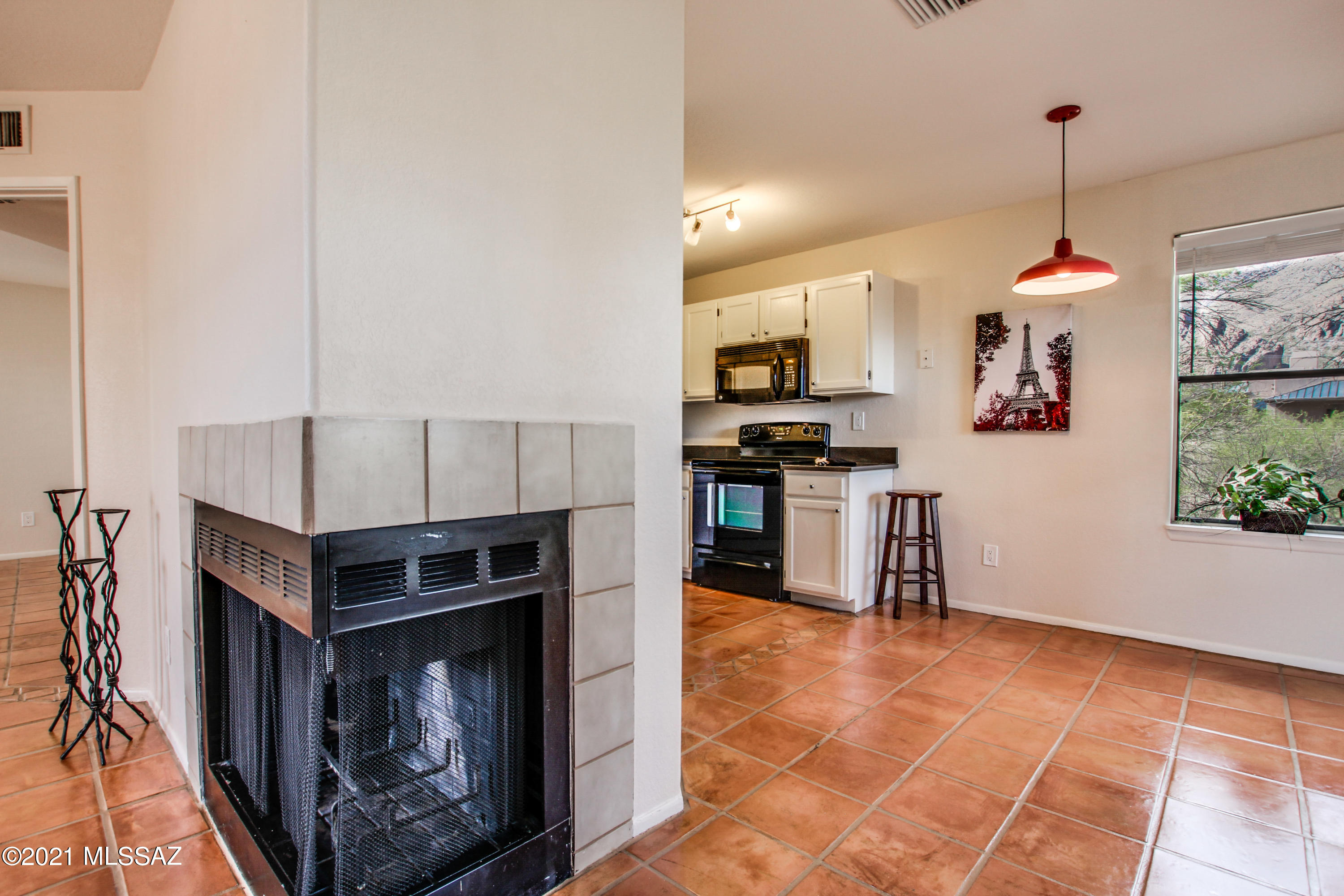 Wonderful condo with private balcony and mountain views!  Living room with large front window & fireplace; breakfast area overlooking trees & Catalina Mountains; spacious kitchen w/pantry, and all appliances stay,  Truly wonderful subdivision with all the amenities next door to Ventana Canyon Resort, Sabino Canyon, hiking/biking/golf -