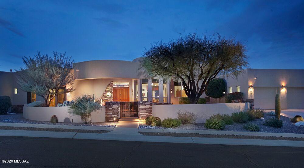 Extraordinary City And Mountain Views From This Ridge Top Home In Gated Sabino Mountain : Courtyard Entry:
Pristine Contemporary With Open Easy Floorplan-No Interior Steps: Incredible Great Room With Enormous Curved Window To View The City Lights: Gourmet Kitchen With Cherry Cabinets/Granite Countertops /Stainless Steel Appliances/Walk-In Pantry and Nook with Thimble Peak Views: Split Bedrooms - Spacious Master Suite with Jetted Tub/ Separate Shower/Double Vanities/  Walk In Closet And French Doors To Pool: 2  Additional Bedrooms And Office(Could be 4th Bedroom) With 3 Baths: 3 Car Garage: Gorgeous Pool/ Spa and Built In BBQ With Sweeping Mountain And City Views.