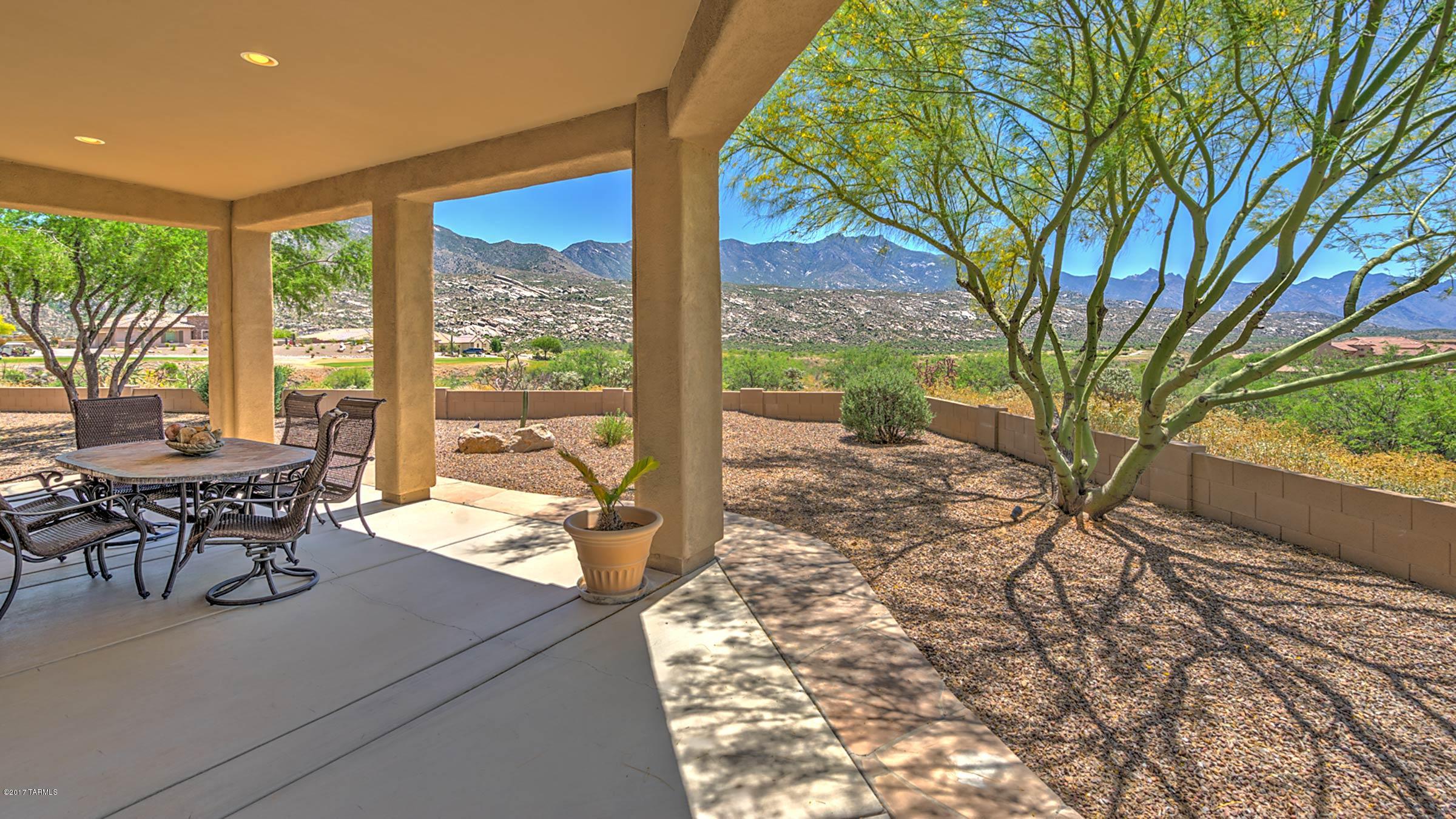 The moment you walk through the front entry gate you feel like you are entering a private mountaintop retreat. This Sonoran model in the Preserve is sited at the end of a quiet culdesac high above the golf course & surrounded by a ravine affording great privacy.  Courtyard w/unobstructed golf & mountain views & leads to the wraparound patio. The great room has a wall of windows overlooking the ravine & opens to a gourmet kitchen w/stainless appliances & granite counters. Butler's pantry leads to formal dining room. Spacious master suite w/separate sitting area & en-suite w/double walk-in shower, soaking tub & dual vanities leading to walk-in closet. Private guest suite, separate casita, + 3 car garage. Whether you want mountain, golf or sunset views, this beautiful home has it all.