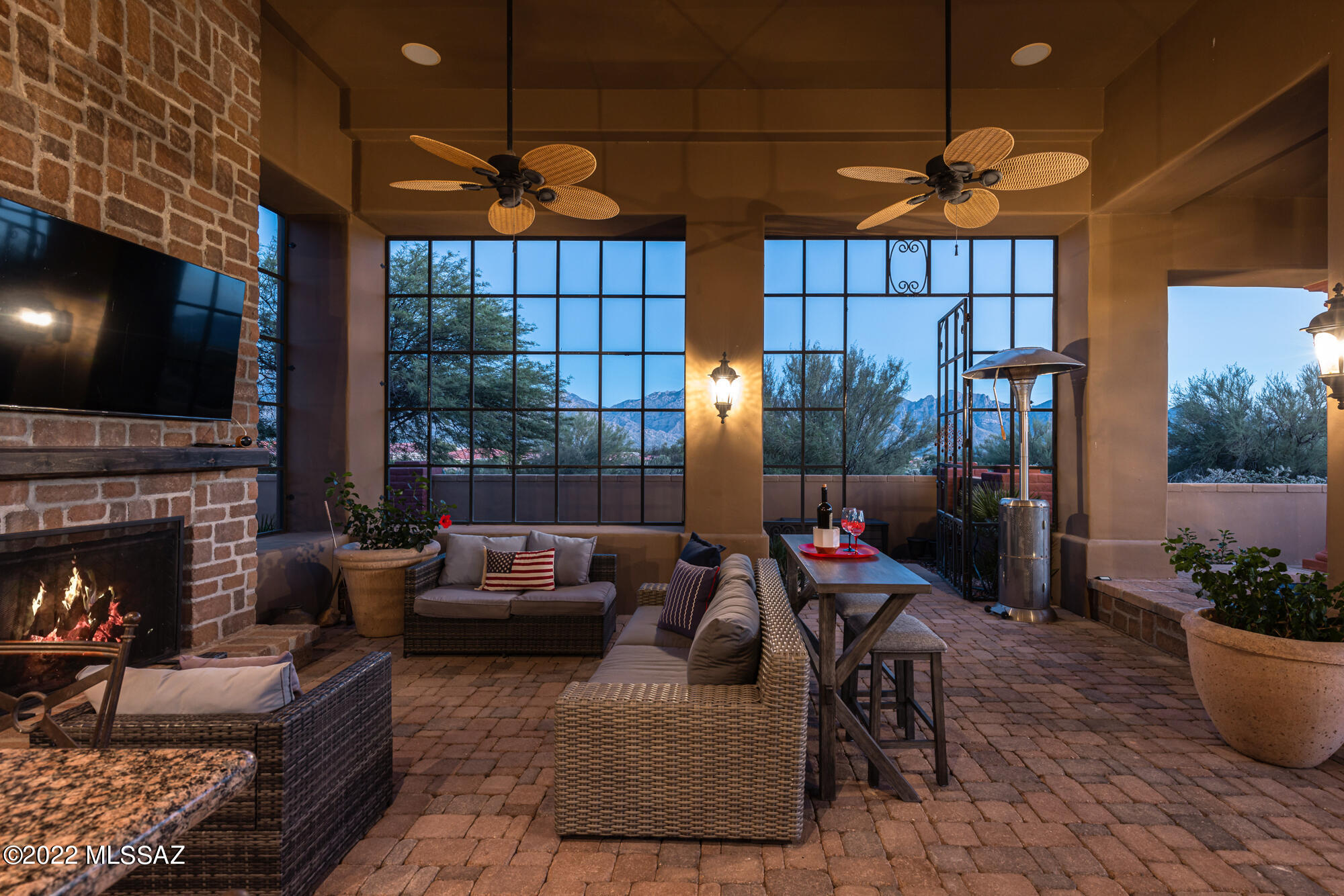 Magical setting with mature landscaping, multiple serene patios & scenic Catalina Mtn views.  Elegant, gracious Mediterranean villa on private east-facing site in guard-gated Estates at Honey Bee Ridge in Oro Valley's upscale Rancho Vistoso development. Masonry construction, Travertine floors, formal & informal areas, office, powder room, 4 ensuite bedrooms (1 in att'd Guest House), tons of storage plus 4-car garage! Grand chef's kitchen with large bar, 2 dishwashers, Sub-Zero ref & 146-bottle wine ref, Viking range, Butler's pantry w/2nd ref, M/W & warming drawer. Splendid master suite w/2-way Fpl, exercise area, patio, spacious bath, in/outdoor shower & 2 HUGE walk-in closets w/built-ins. You'll LOVE the amazing outdoor lounge with BBQ kitchen, Fpl, inviting pool/spa, and Catalina views!