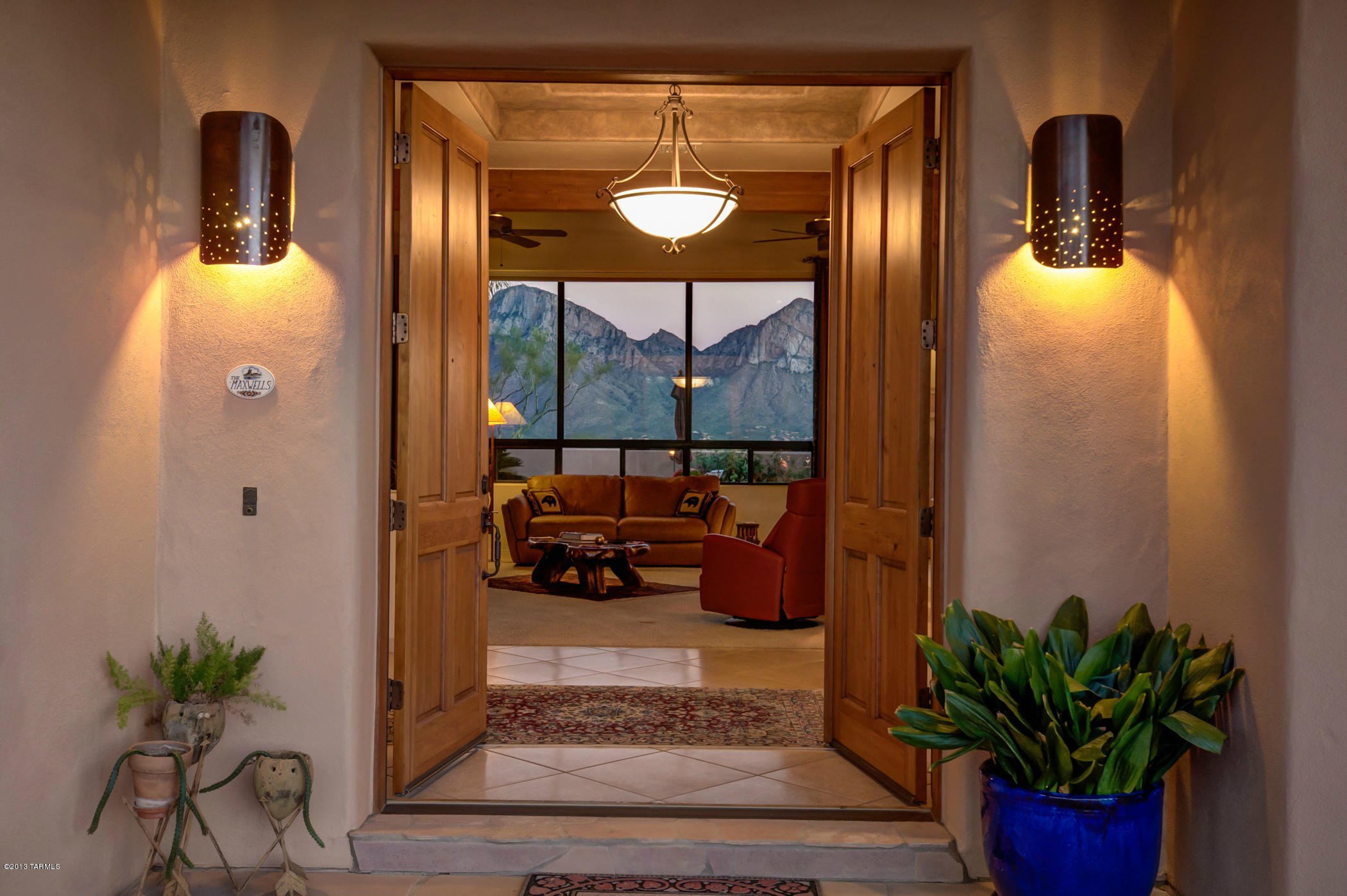 Previous TAR Home Tour Winner! ABSOLUTELY STUNNING VIEWS! Pusch Ridge will take your breath away when you walk into this Beautiful SW Contemp. Custom Home w/ Split Bdrm flr plan.  Unparalleled Catalina Mt. Views w/ Panoramic City Lights on 1.5 ac. Great Room Design w/ flr to ceiling Slate Tile FP, Doug. Fir Ceil./Rough Sawn Beams and Wet Bar/Wine Rack for your Entertaining Pleasure.  Sld. Cherry Wood Cabs warm this Kitchen, SS Apps, Slab Gran. and App. Garage.  Formal DR has built-in Cherry Wood Buffet w/Slab Gran. Top.  Dbl Knotty Hemlock Entry, Pecky Cedar Entry Overhang, Knotty Hemlock Doors, 20 in Diag. Tile Flr. thru out w/ Plush Carpet in bdrms. Your Private Outdoor Living area incl. Deep Flagstone Patio, Pool, Spa, Built-in BBQ, Spiral Str. Case leads to Lit Rooftop for Stargazing! More recent improvements include high quality carpet 2017, One new HVAC unit 2018, Water heater replaced 2018. New pool filter and housing 2018. New SS refrigerator 2018, Water softener system 2019, Reverse osmosis system 2019, New skylights 2019/20,  Roof re-coated 2019, Exterior paint 11/19  and Ring Doorbell 2020.