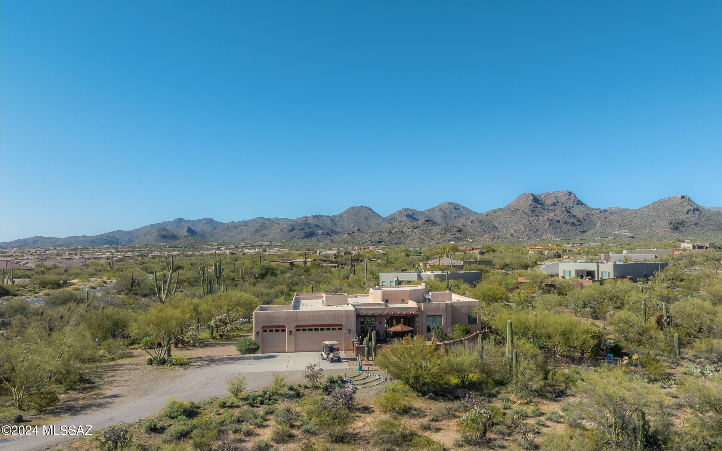 Exquisite location - custom built single story home on 4 ares surrounded by oasis garden grounds. Spectacular mountain, city light, sunset & sunrise views. Panoramic beauty everywhere. This private & serene location has No HOA, city water, propane gas. There are No steps & No carpet. Sellers expanded the home pushing out the kitchen to a grand chef's masterpiece + added an additional bonus/craft/art room, remodeled master bathroom with a one-of-a-kind custom metal art barn door & expanded the gated front artistic courtyard. Property will convey with a plethora of installed outside custom local art pieces. A list of art pieces will be provided. HVAC units have been replaced in 2018 & 2020. Electric hot H20 heater replaced in Feb 2018. Private, serene living surrounded by nature & beauty.