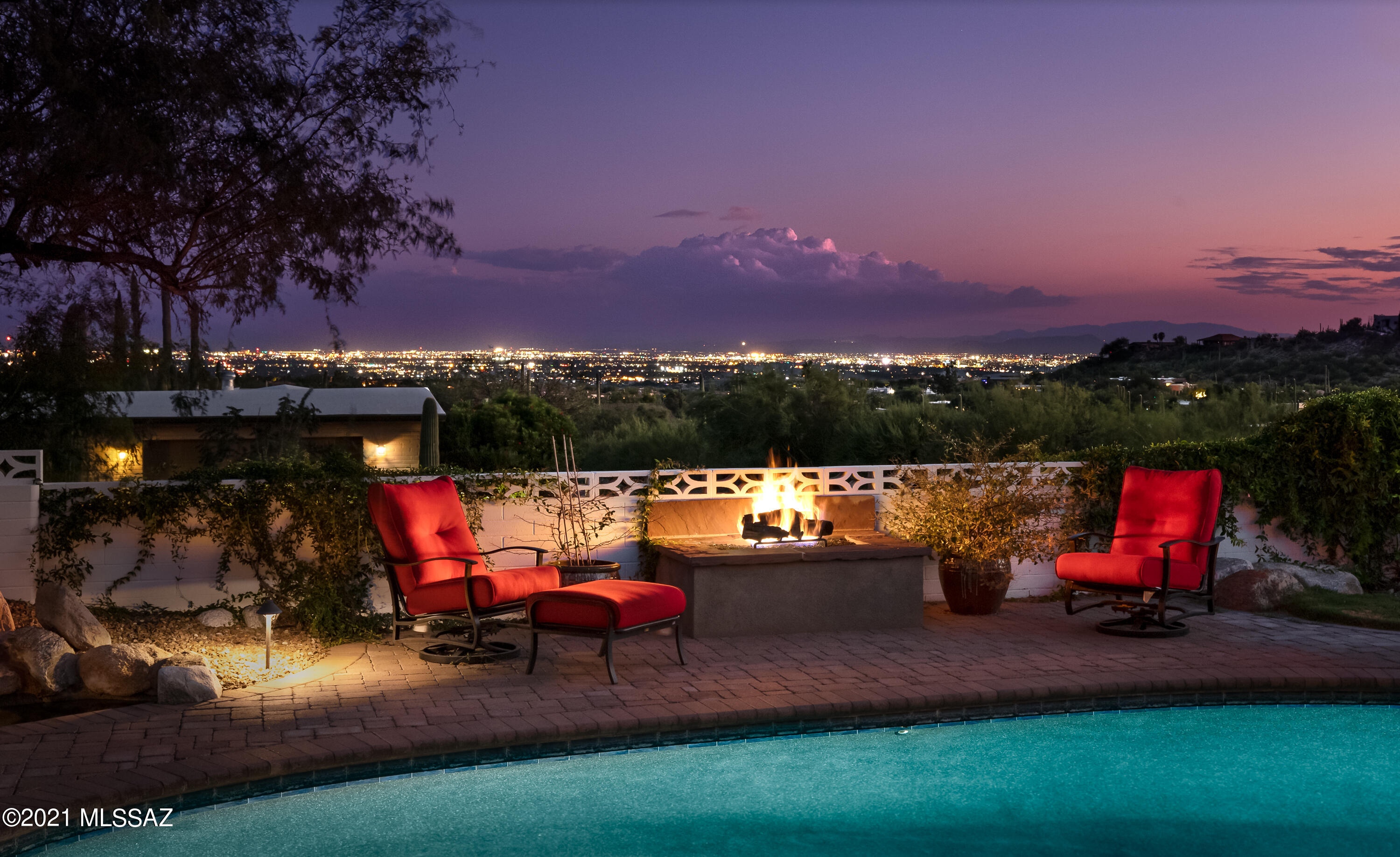 Enjoy Catalina Mountain, Sunset & City Views from Coronado Foothills Estates .83-acre cul-de-sac lot. 2,284SF 2BR/2BA main house & 480SF 1BR/1BA guest house. Built in 1973 but completely remodeled w/gorgeous slate floors, granite counters, wine cooler, Wolf Gas Range, Sub-Zero Fridge, Alder cabinets w/pull-outs. Casual & Formal Dining areas. Family room off kitchen has corner fireplace. Solid Alder doors. Pella Windows. Covered patio & Pebble-Tec pool + enclosed patio w/mini-split; great for workout room. 2 car garage attached to home & add'l detached 2 car garage. Voluntary HOA $75/annually. Secluded in foothills of Santa Catalina Mountains & just minutes away from Downtown Tucson, UofA, La Paloma Country Club & Skyline Country Club & LaEncantada w/premier shopping & specialty restaurants
