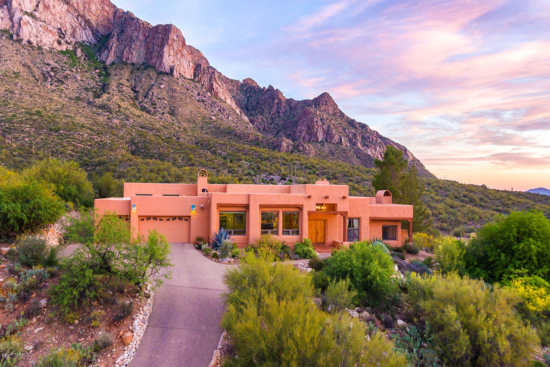 Best views Oro Valley has to offer! Panoramic Catalina Mountain & city light views from every room in this recently renovated home which overlooks the National Forest & Pusch Ridge Wilderness Area.  Located in the guard gated community of La Reserve, this 4bd (3,681sqft), 3 car garage home is like no other! Completely remodeled kitchen with Acacia hardwood floors, new high-end appliances, custom cabinetry, island w/ granite surface and slate countertops. Completely remodeled master bedroom/bath/closet w/ new floors, Venetian plaster fireplace, custom cabinetry, countertops, and fixtures. Too many renovations to list (see attached document). Outdoor living at its finest with sparkling pool/spa, professional landscaping and views! Minutes from Tucson. Will please the most discerning buyer.