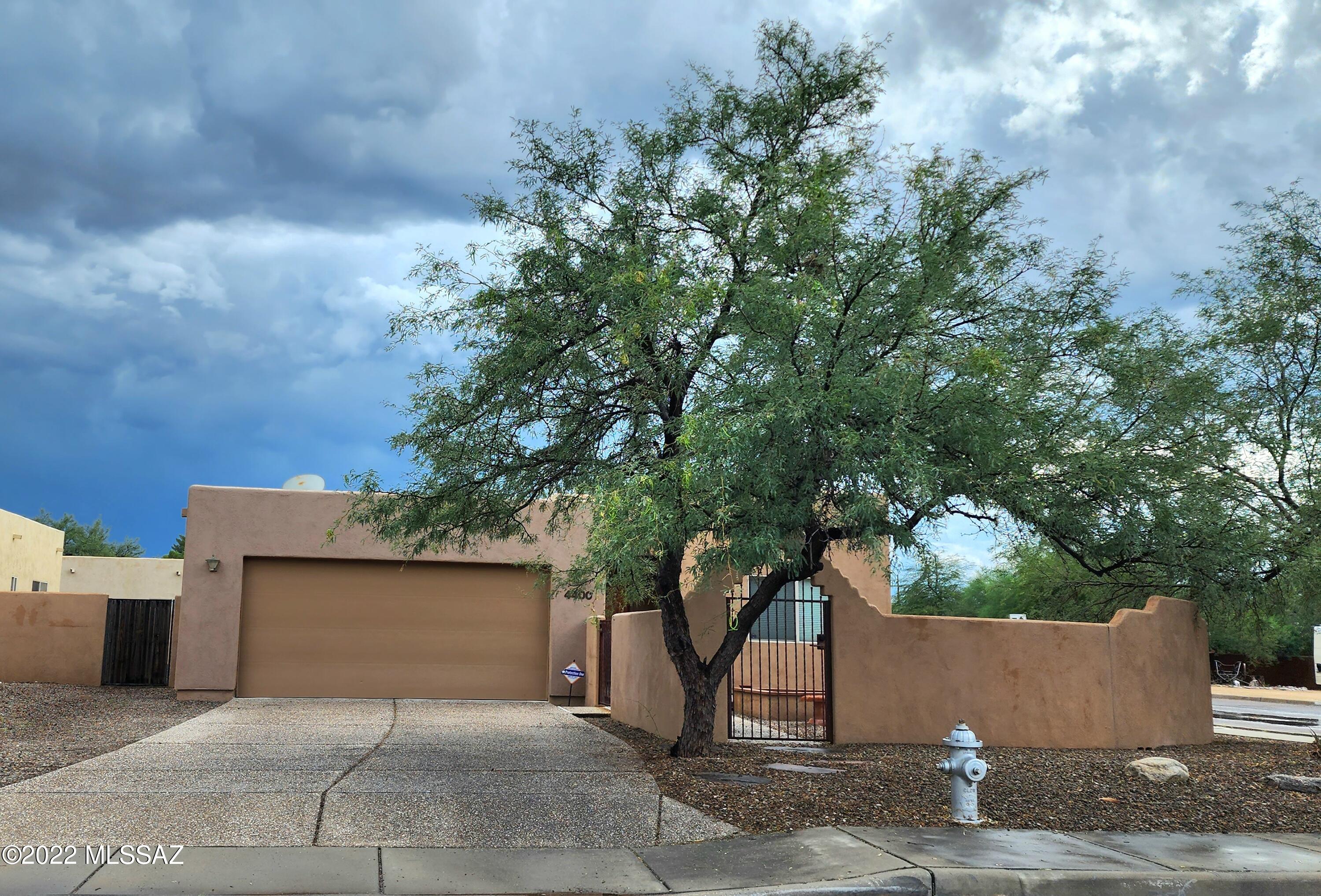MOVE IN READY 4 bed/2 bath home in convenient central Tucson! 
Upgrades everywhere in this open floorplan corner-lot property!  Granite countertops throughout. Open kitchen with island, GE Profile Appliances, gas range, island with breakfast bar, wine/beverage cooler, hardwood cabinets, and large pantry. Home has 21-inch travertine tile flooring in all the wet areas and dining room, carpet in living room and bedrooms.  In-wall speakers for surround sound!  SPACIOUS Master Suite with walk-in closet and dual sinks. 4th bedroom is a great den/office. Recessed lighting throughout the home. 5-ton Ruud a/c unit installed 4/2022. Enter through an AMAZING courtyard with a built in firepit and sitting area. A must-see home! Call to schedule your showing today!