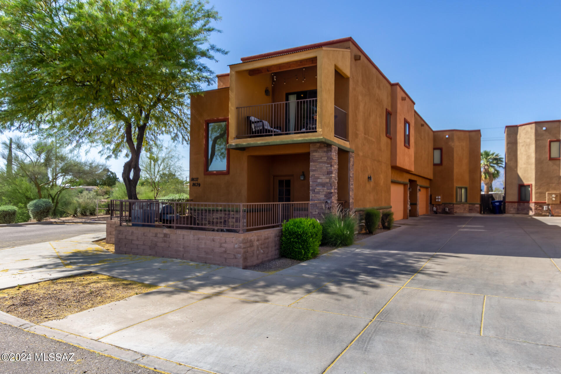 Awesome Listing in Dos Tiburones!  3 bedrooms, 2 full bathrooms, 2 car garage, fenced yard, balcony, and end of the street with west sunset views! 
As you enter the home, there is 1 bedroom downstairs with attached bathroom with walk in shower, walk in closet, access to front yard. Upstairs you have newly installed wood flooring, family room is open to the dining room and kitchen. Balcony faces south and perfect for your morning coffee! Kitchen has granite tiles, new dishwasher and black appliances. Bedrooms 2 & 3 upstairs with dual vanity bathroom, tub shower, and wood flooring throughout. New AC unit, updated lighting and paint. HOA FEES INCLUDE: Exterior maintenance of all homes, community common areas, roof, all water, sewer, trash utilities.