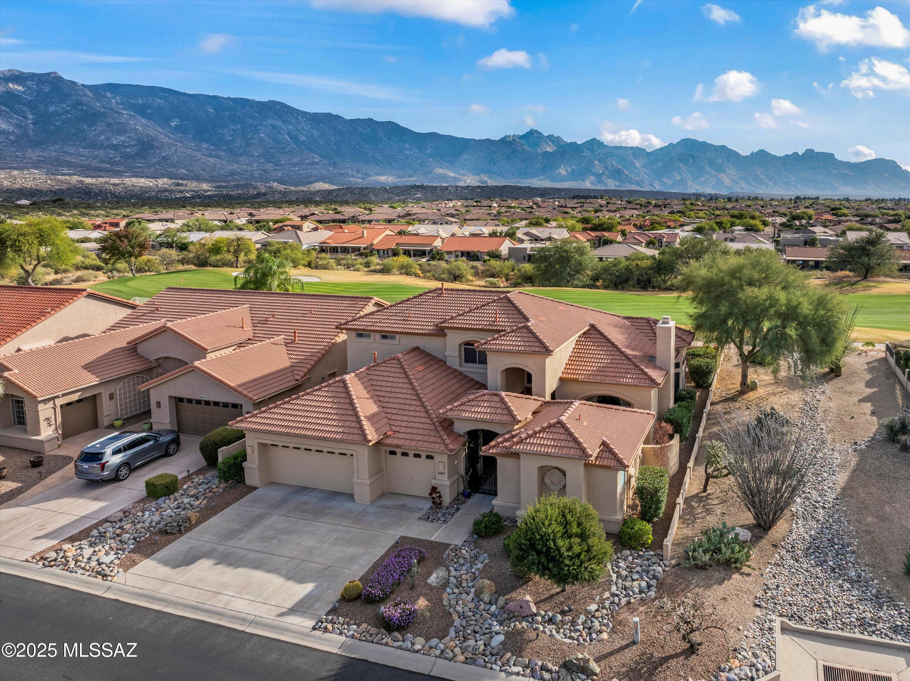 This spacious Sundance model with Casita boasts an unobstructed golf course and mountain view. Whether inside or outside, the views spread out before you are stunning. The double door entry leads to a welcoming gathering space with gas fireplace. Formal dining room is light & bright with a circular wall of windows.  Island kitchen with gas cooktop is open to spacious family room where the wall of windows takes full advantage of the views. Owner's retreat has en-suite with 2 closets, plenty of cabinetry, double vanity, walk-in shower and soaking tub. Upstairs guest suite with 2 bedrooms & Jack & Jill bath. Convenient den with built-in desk, powder room, separate guest Casita, & full 3 car garage. Outdoor living at its best on the private covered patio & expanded hardscape surrounding the freeform pool & spa while enjoying the stunning views. Come and enjoy the best of SaddleBrooke living.