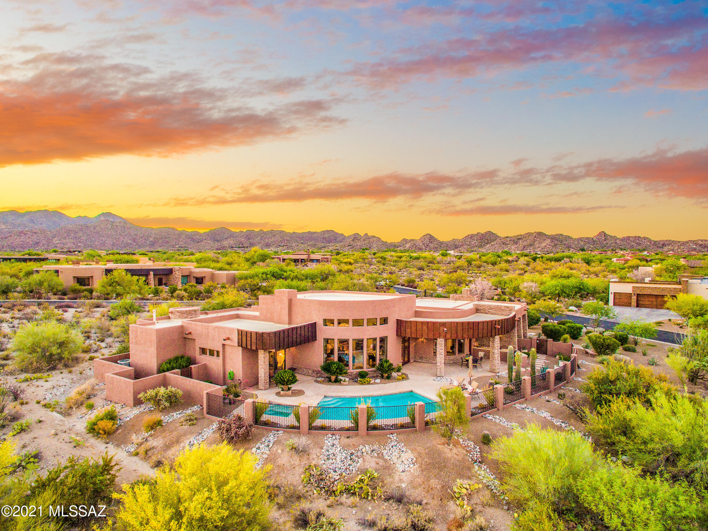 Soaring windows frame SE-facing views of majestic Catalina Mtns and open desert. Striking 4,117 SF contemporary built 2014 with 3BD, 4BA, Office/Den, Media Rm and pool/spa plus BBQ kitchen under covered patio. Stacked stone gas fireplace, travertine & wood flooring, high ceilings, wetbar, formal dining room and split layout. Chef's kitchen includes large island, desk area by nook, prof gas cooktop & hood, double ovens, warming drawer, M/W drawer, compactor, and built-in refrigerator. Located in guard-gated Stone Canyon, Phil Mickelson's championship private golf club in premier NW Tucson resort area (membership req'd).  Short walk/drive to Clubhouse & Fitness Center. Enjoy excellent restaurants, schools, hospital and shopping in Oro Valley, the Scottsdale of Tucson! Available furnished.