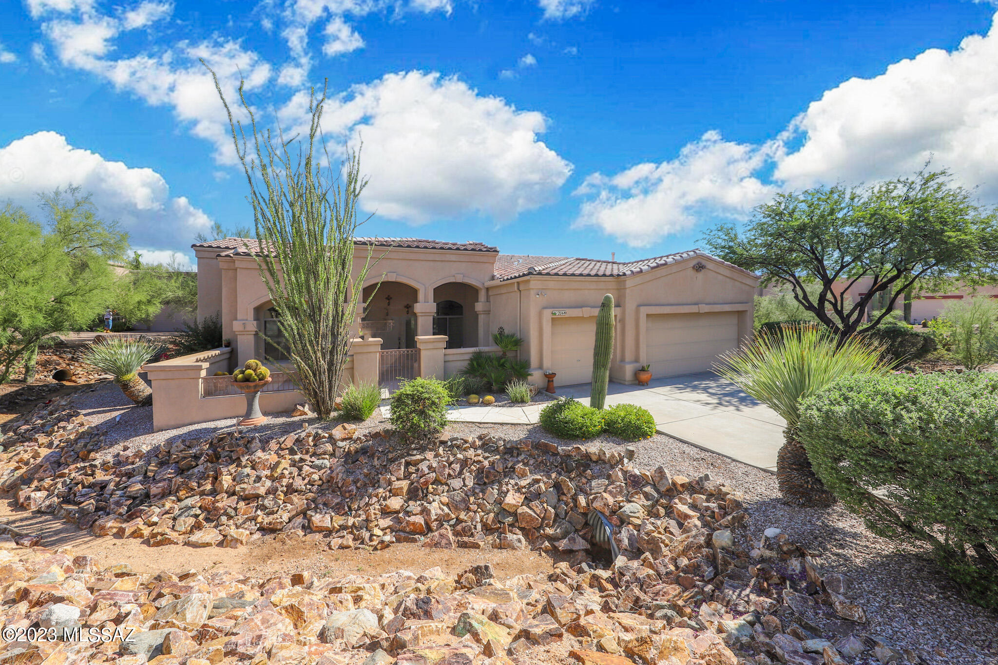 In the heart of Oro Valley sitting on a cul-de-sac street, this fantastic home boasts a fabulous location, mountain views, a pool and spa & a backyard oasis.  High ceilings &large windows welcome you as soon as you enter the home. The back of the home boasts walls of windows to enjoy the scenery of your backyard and mountain views.  The kitchen has enough cabinet &countertop space to make any chef happy. You will find that all the bedrooms are generous in size. The master bathroom is complete with soaking tub, double vanities and a makeup space along with two walk-in closets.  Enjoy the jetted walk-in shower.  Outside you will find a fantastic, covered patio space facing East which means you get to enjoy the Tucson sunrises and avoid the afternoon sun. This home is ready for you today!