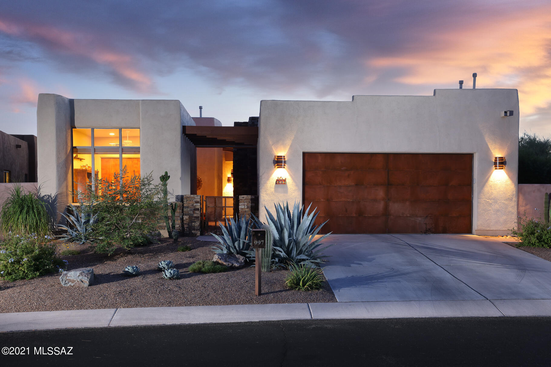 Architecturally stunning home designed by renowned Tucson architect Kevin Howard. Nestled within the highly sought-after luxury gated community of Stone Village, this home is perfect for seasonal or year-round living. Welcoming open concept great room boasts high ceilings, curved walls, tall windows and cozy fireplace. Grand chefs kitchen features high-end stainless appliances and large island perfect for entertaining. Owner's retreat features gorgeous built-in cabinetry with a luxurious spa-like bathroom. Two spacious guest bedrooms each with deluxe ensuite bathrooms. Separate casita perfect for guests. Outside is your private retreat which features multiple seating areas, beautiful gardens and sparkling spool. This relaxing backyard oasis was featured in Tucson Lifestyles Magazine!