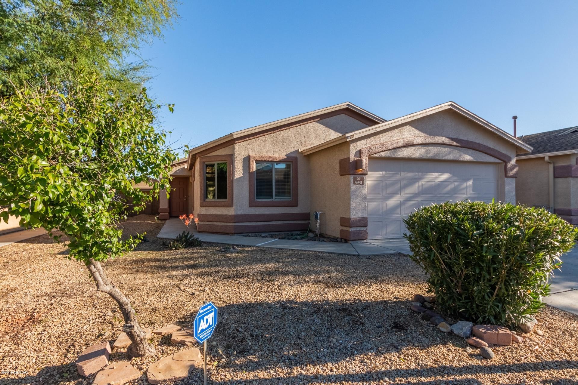 Beautiful move in ready 4 bed/2 bath south Tucson home available in highly sought after Canterbury Ranch. Very convenient location, near schools and parks and just minutes from I-10. Fresh paint inside and out! Step into an excellent open concept floorplan which is perfect for entertaining. Spacious living area features vaulted ceilings and wood look flooring. Kitchen is complete with a pantry, white appliances including a gas stove, and plenty of cabinet and counter space. Bedrooms are generously sized with brand new plush carpet and the master includes a private ensuite with a separate tub and shower. The huge, fully enclosed backyard offers a covered patio and lots of room for pets or play. This gem is available at an excellent value and will sell fast. See it today!