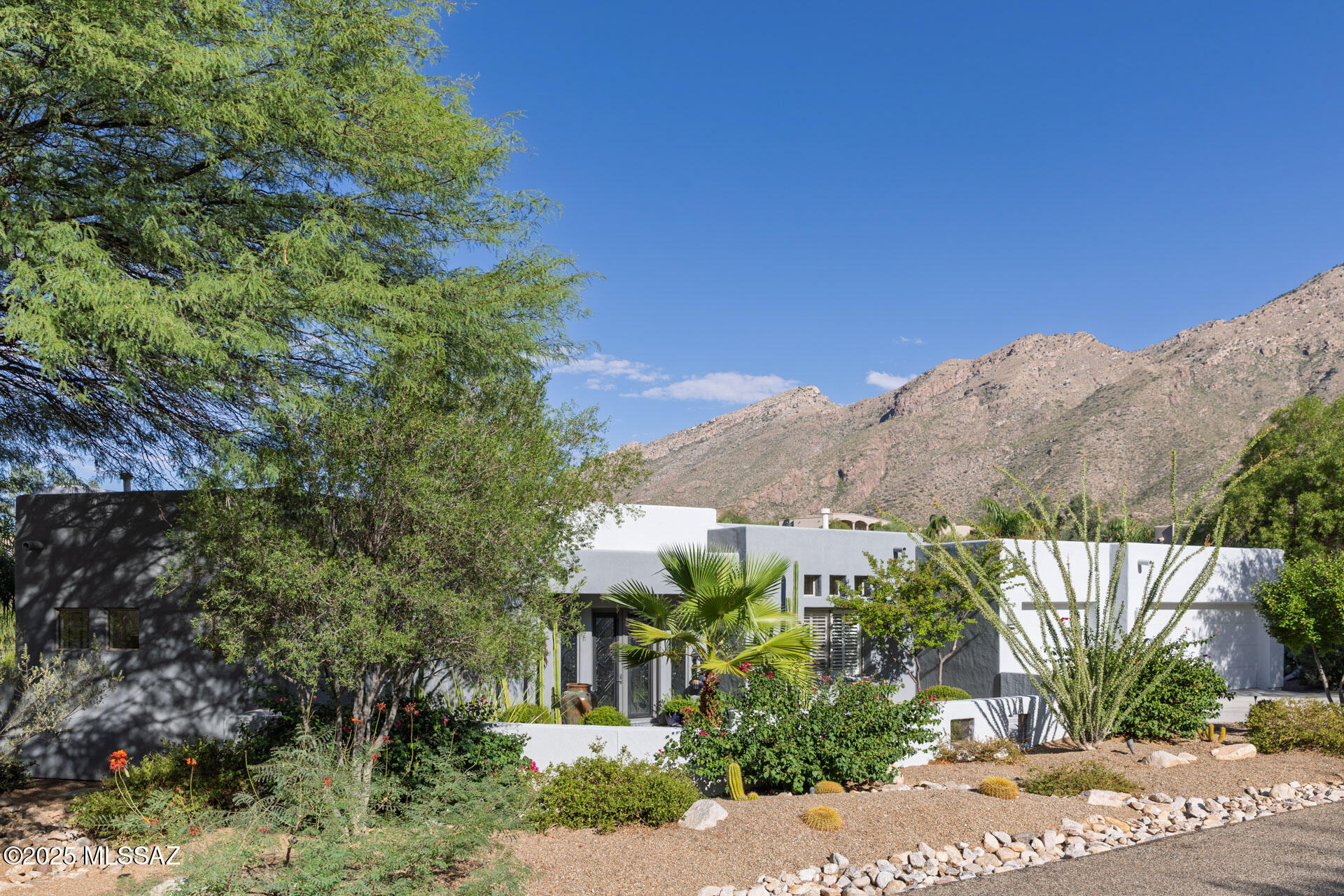 You will be in love the moment you enter the courtyard of this breathtaking custom 4BR/ 3BA 2,863 sq ft home within majestic Alta Vista Estates. Exhibiting truly exceptional mountain, sunset and city views among a stunning outdoor oasis.  Enter through beautiful custom stained glass doors into a large bright living room/dining room surrounded by windows.  Great split floorplan,14 ft ceilings and porcelain tile throughout. Impressive gathering/family room showcases media wall with fireplace. Striking gourmet kitchen hosts SS appliances including Thermador refrigerator, dual oven Viking gas stove and quartz coutertops. Primary Bedroom features lovely views and an extra large walk-in closet with built in cabinetry. Luxurious primary bathroom includes soaker tub, curbless shower with jets and exquisite granite countertops. The serene outdoor oasis complete with pebbletec pool and spa and views abound will not disappoint.