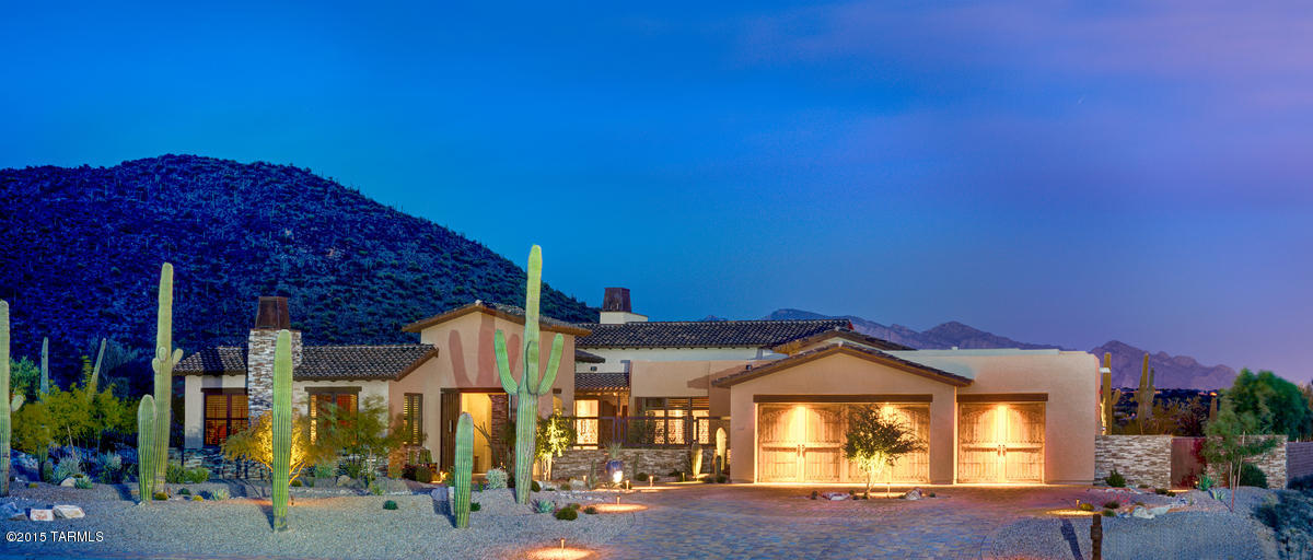 Enjoy the Ritz-Carlton Lifestyle! This luxurious home is nestled on the Jack Nicklaus Signature 27-hole Golf Course. Includes Ritz-Carlton Concierge Services & access to Ritz-Carlton Pools & Fitness Center. This four-bedroom plus den plan is a private sanctuary & entertaining dream. The impressive great room has a warm fireplace, soaring wood beam ceiling & trusses. Home has spectacular views of Tortolita & Catalina Mountains framed by retractable glass walls. Split bedroom plan with 3-car garage. Incomparable master suite w/ direct outdoor access. Natural Stone/Wood/Carpet floors, Granite Counters, Sub Zero/Wolf appliances, Home Automation & Wine Rm. 1br/1ba casita-perfect for your guests.  Large outdoor entertainment area including a 12 ft. Pebble Tec Spa, Fire Pit & Outdoor Kitchen. Enjoy the Ritz-Carlton Lifestyle! This luxurious home is nestled on the Jack Nicklaus Signature 27-hole Golf Course. Includes Ritz-Carlton Concierge Services & access to Ritz-Carlton Pools & Fitness Center. This four-bedroom plus den plan is a private sanctuary & entertaining dream. The impressive great room has a warm fireplace, soaring wood beam ceiling & trusses. Home has spectacular views of Tortolita & Catalina Mountains framed by retractable glass walls. Split bedroom plan with 3-car garage. Incomparable master suite w/ direct outdoor access. Natural Stone/Wood/Carpet floors, Granite Counters, Sub Zero/Wolf appliances, Home Automation & Wine Rm. 1br/1ba casita-perfect for your guests.  Large outdoor entertainment area including a 12 ft. Pebble Tec Spa, Fire Pit & Outdoor Kitchen.

Specs:
4,724 Sq. Ft. home including private 624 Sq. Ft. Casita with kitchenette
Desert Sonoran Elevation with beautiful stacked stone
Four bedrooms each with on suite, powder bath, great room, family room & Den
Hacienda style finishes similar to the Ritz Carlton Dove Mountain Hotel
Three indoor fireplaces in the great room, master bedroom and casita
Private pet friendly courtyard with outdoor fireplace and fountain
Numerous outdoor seating areas and entertainment areas with built in gas heaters and firepit
384 bottle wine cellar
Whole house Sonus music system
Beautifully landscaped and private   .85 Acres lot with 23 native Saguaro cactus, native iron wood tress, fruit trees, artificial grass and Belgard pavers
Golf membership at the Dove Mountain Golf Club included
