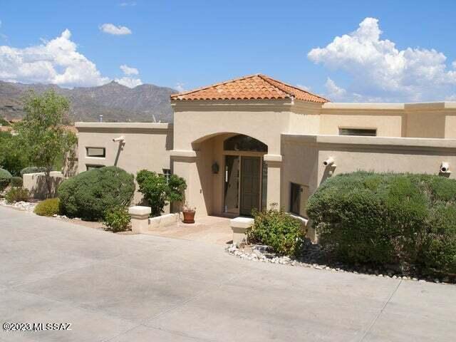 Spectacular views of the Catalina, Rincon, and Santa Rita mountains awaits you from the massive view windows!  This very private 5 bedroom (or 4+den) home sits on over 1 acre and features high ceilings, a 3 car garage, a secluded pool with spa, and a magnificent covered patio for outdoor entertaining.  The spacious kitchen has a large breakfast area and is open to the family room.  This wonderful floorplan was built for entertaining.  This is a fantastic price for a home in one of the best communities on the foothills.  Perfect for a light renovation and priced low for this reason.  Plumbing, HVAC and HW tank appear to be replaced, check with your Inspector.
