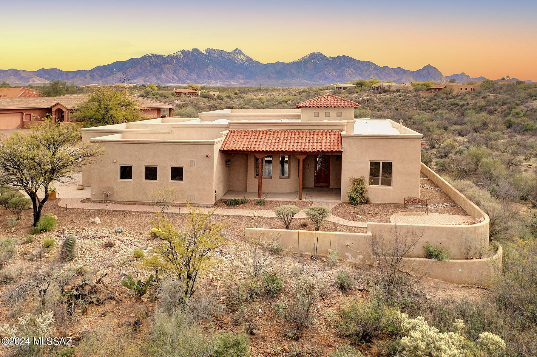 This magnificent lot offers you the VIEWS and PRIVACY that you have been waiting for in Green Valley! Sitting high above the wash at the end of a cul de sac and backing up to federal land with absolutely nothing but mountains behind you, this is truly a special place to spend your next journey in life.  The grand estate sitting on this lot has been situated to take advantage of every mountain view from inside of the home.  Step inside to soaring ceilings and walls of windows framing the views. The great room is wide open and incredibly spacious with an impressive formal dining area.  The luxurious 
kitchen sits in the center of the great room and  can accommodate almost any event you can dream of.  A breakfast nook looks out to the patio and those beautiful mountain views!  The living area is anchored by a glowing fireplace and wood framed sliders open to the patio for indoor/outdoor entertaining.  A formal den sits directly off of the great room and can be closed off when guests arrive.  Your primary suite is beautiful with access to the patio and breath taking mountain views through the windows.  The bath has a resort feel with a huge soaking tub and glass block walk in shower.  Two guest suites on the other side of the home offer plenty of space and privacy.  If your desert dream includes a remarkable home surrounded only by natural beauty,  then this may be the end of your search!