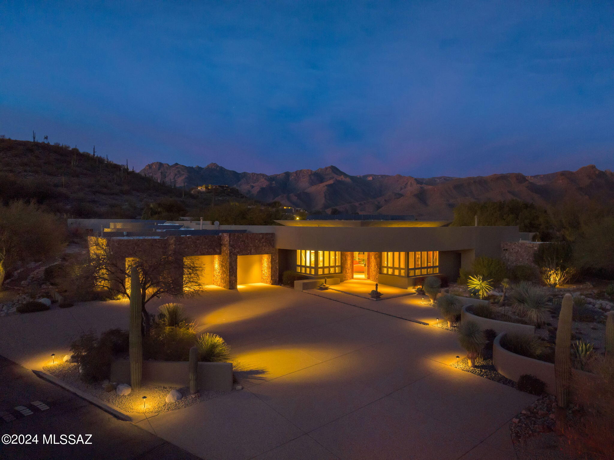 A sparkling 1 acre and 4700 sq ft gem perched atop the highest ridge on the grounds of globally reputable Canyon Ranch Health & Wellness Resort.
Maintain it as your permanent home or a vacation sanctuary, you will always be able to pamper yourself in a serene and peaceful slice of heaven. This house boasts contemporary architectural design, superior construction quality while adhering to efficient use of space, with high ceilings, open floor plan, and sustainability, through its full solar power support.
No expense was spared on the fixtures, appliances and the cabinets throughout.
Floor-to-ceiling windows around the house invites panoramic views of the surrounding mountains and the various views of Arizona painted desert inside the house. The multi-deck patios and terraces along with the outdoor grill/ kitchen and its appliances provide a perfect environment for a poolside entertainment. 

Tray-ceiling design embedded with horizontally lineup windows as well as recessed-lighting, provide ample natural light and brightness throughout the great room, kitchen/breakfast bar and the breakfast nook. No shortage of skylights throughout the kitchen and the five bathrooms beaming in soothing natural light. 
Spacious primary suite with a fireplace, sizable closet. Ensuite with a separate oval tub and shower provide ultimate in
 comfort coziness. 
All bedrooms have full private ensuites with efficiently designed closets for ample storage. 
Ceramic tile flooring throughout great room, kitchen and bathrooms. Lush quality carpeting throughout all bedrooms.

This house is move-in ready.  
Furniture, appliances and artwork, (except for a few selective items), will convey with the sale of the house at no cost. 

Your Homeowner's Membership provides you unfettered access to the resort facilities such as spa, state of the art gyms, tennis courts, pickleball, five pools and an indoor aquatic healing center. Participate in various group fitness and meditation classes, arranged hikes and bike rides, treat yourself to a plethora of bodyworks performed by seasoned practitioners and fitness trainers. Enjoy delightfully prepared healthy meals at one of the two gourmet dining venues.
Canyon Ranch living is where luxury meets perpetual comfort of soul..