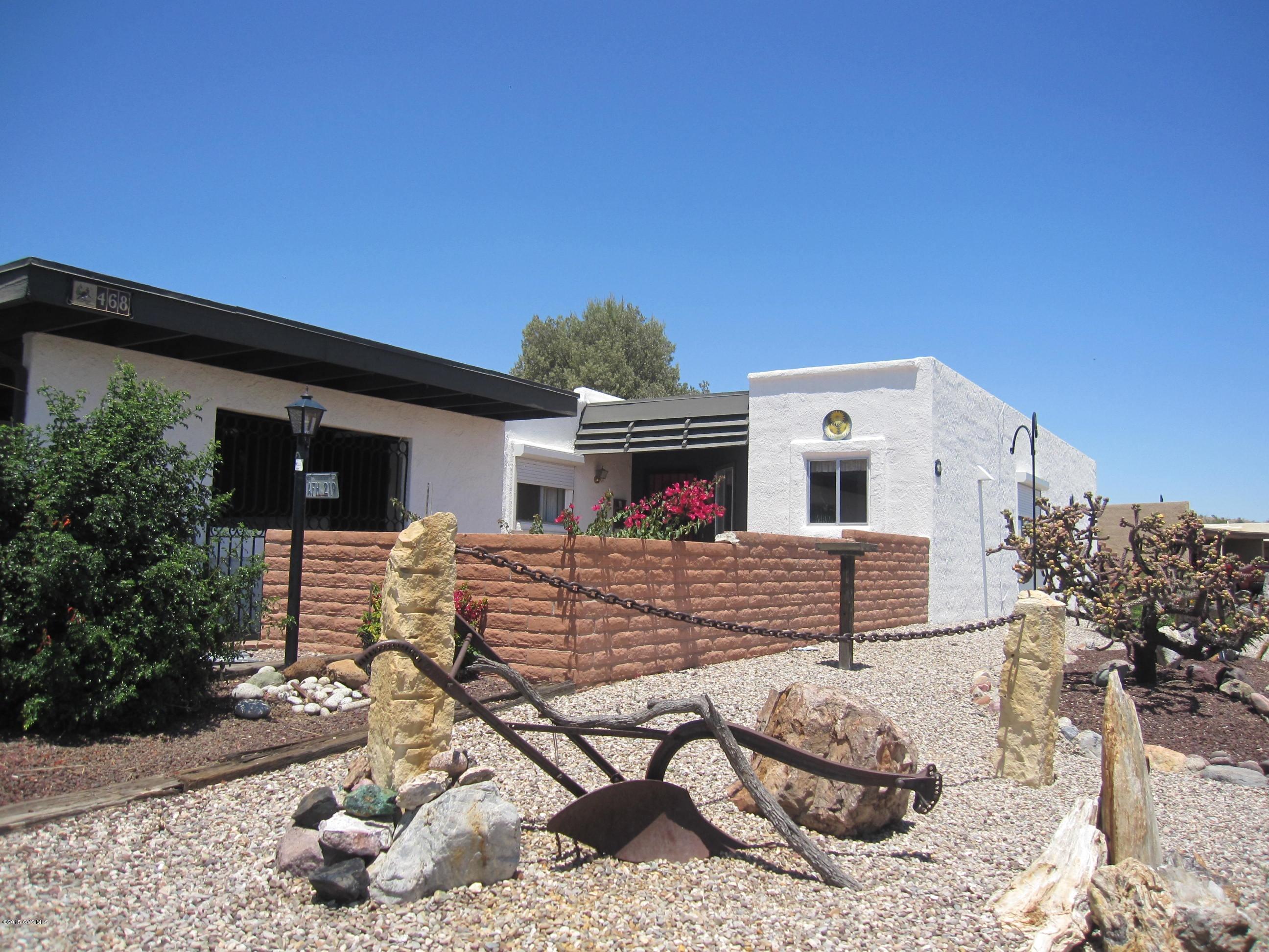 ONE-OWNER END UNIT WELL-KEPT TOWNHOME ON CUL-DE-SAC. SURROUNDED BY LUSH DESERT WITH VIEWS OF THE SANTA RITA MOUNTAINS! COMPLETELY FENCED EASY-CARE BACKYARD WITH BRICK PAVERS. SCREENED ARIZONA ROOM WITH BEAUTIFULLY BUILT-IN STORAGE CABINETS. SPACIOUS AND LIGHT-FILLED WITH CEILING FANS IN EVERY ROOM! THE OPEN DEN GIVES YOU PLENTY OF ROOM FOR A LIBRARY, OFFICE, OR TV ROOM. GREATROOM HAS DINING AREA AND ATTACHED WOOD WALL UNIT. ROLLING SHUTTERS ON BOTH OF THE EAST WINDOWS. ADDITIONAL SPACE IN THE STORAGE ROOM OFF THE DOUBLE CARPORT. SPACIOUS, BRIGHT EAT-IN KITCHEN. YOU'LL LOVE THE VIEW OF THE MOUNTAINS! GREEN VALLEY RECREATION IS AVAILABLE. THE VILLAGES SUBDIVISION HAS A COMMUNITY POOL, RECREATION ROOM, LIBRARY, TENNIS AND PICKLEBALL COURTS. YOU'LL HARDLY HAVE TO LEAVE HOME!