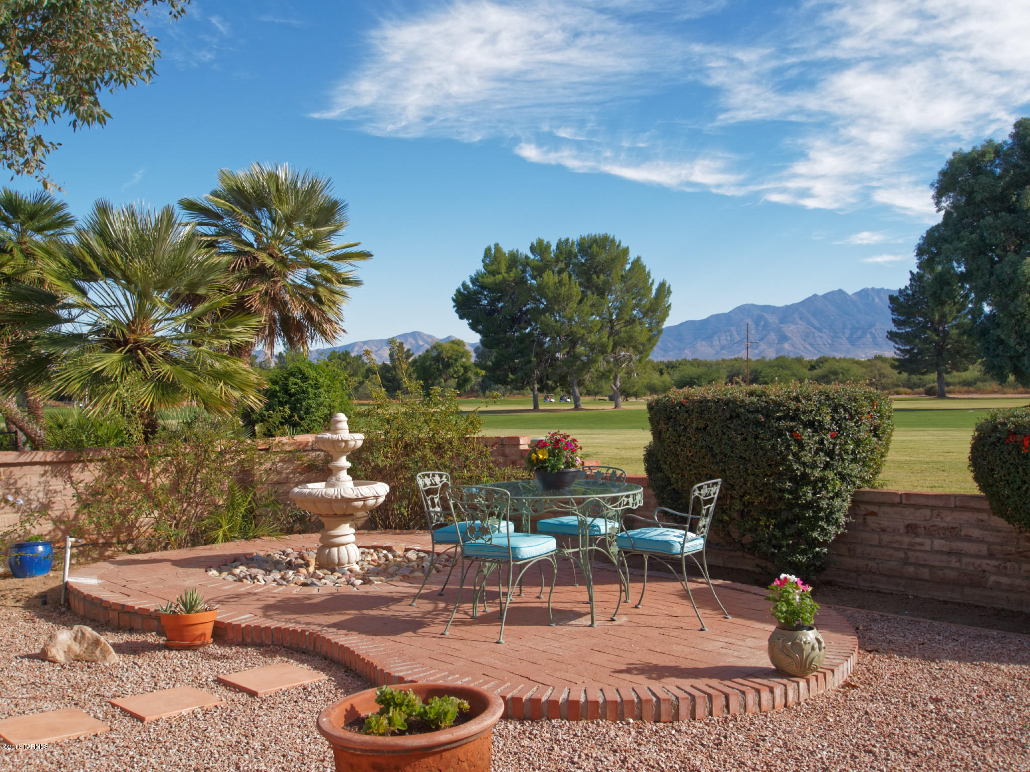 Enjoy this beautiful home setting on Haven Golf Course. You will enjoy looking at the Santa Rita Mountains from Arizona Room, covered patio, or formal dining room. This home features Saltillo tile, upgraded refrigerator and professional gas range, cabinets, granite counter tops with under mount sink, gas fireplace, Arizona room and a craft room.  With nearly $40,000 in improvements in 2015.  Including New air conditioner, water main, tile roof, and the flat roof re-coated.  This is a great value!!!