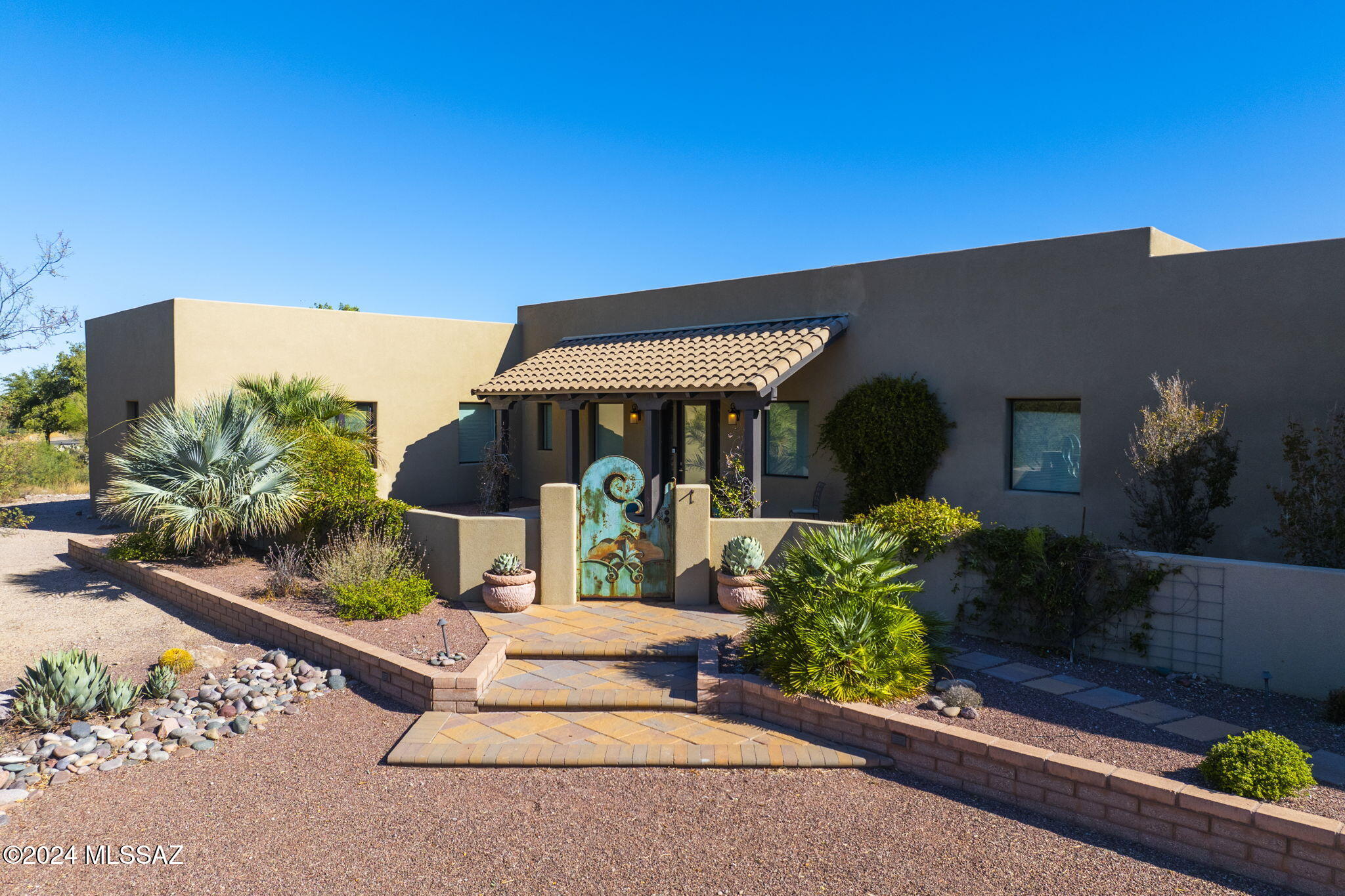 This beautiful estate has a stunning blend of interior and exterior spaces with sweeping views of the Santa Rita Mountains and the Santa Cruz River Corridor.  Many special features of this property include a well designed kitchen with lots of light and an inviting open feel, foam/concrete construction with a smart garage and alarm system for the home. The kitchen also includes stainless steel appliances, incredible views out of the window above the sink, as well as a very functional island/ breakfast bar. The living room offers a gas fireplace with tall beamed ceilings and large picture windows affording breathtaking views of the Santa Rita Mountains. The primary suite features access to the back patio and a large open and light primary bath. See ''more'' This Golf Course estate includes 3058 square feet of easy living, including 3 bedrooms and 3 baths situated on 1.22 acres of land which provides plenty of elbow room and privacy. The outdoor area is designed for entertaining with a gas grill, heated spa and outdoor bar space.  With an enclosed garage for 7 vehicles, there is more than ample room for your vehicles as well as recreational vehicles or that dedicated shop/studio space you have been wanting.  Start living the Tubac lifestyle today and arrange for a tour of this beautiful property.
