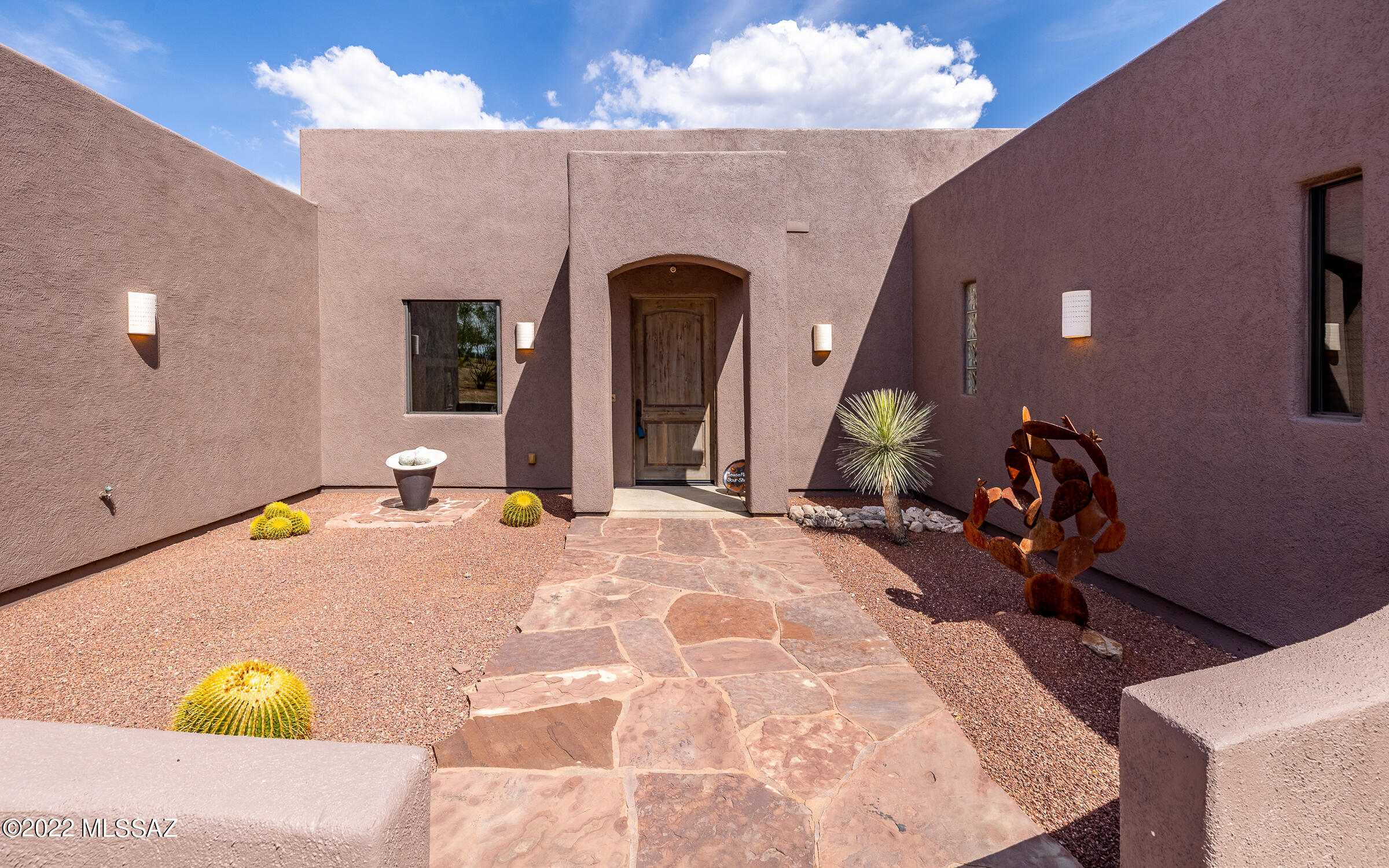 This Gorgeous custom home with 3 car garage is on 1.25 acres and has amazing mountain views from the large picture windows (with retractable privacy shutters). You'll also appreciate the Chef's kitchen with granite counters, center island, custom solid wood cabinets and an open concept ideal for entertaining! Other highlights of this split floorplan include two master suites, all bedrooms have walk-in closets and the home is handicapped accessible. This custom home offers lots of flexibility with office and bonus room and open backyard ready for the new homeowners imagination!