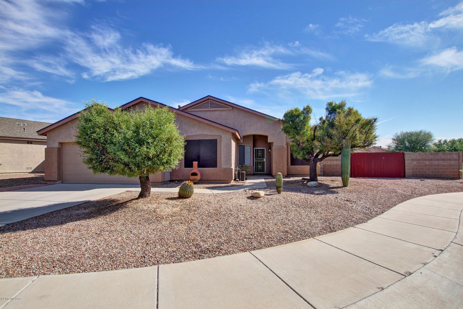 Pristine & Energy Efficient Home nestled on a cul-de-sac lot with RV Gate & Parking. Warm & welcoming palette, soaring ceilings, beautiful tile floor, window blinds, ceiling fans, and plush neutral carpet. Fantastic eat-in kitchen features patio access, center island, breakfast bar, SS appliances, and wood cabinets. Create a feast with family and friends. Cozy family room fireplace with built-in media shelves. Double door entry into Den. Grand master retreat boasts walk-in closet and private en suite. Enjoy the backyard covered patio, grassy play area, fire pit, and room for a pool! A must see Home on your list! Text tvg to 59559 for up to date photos and info on your mobile device.