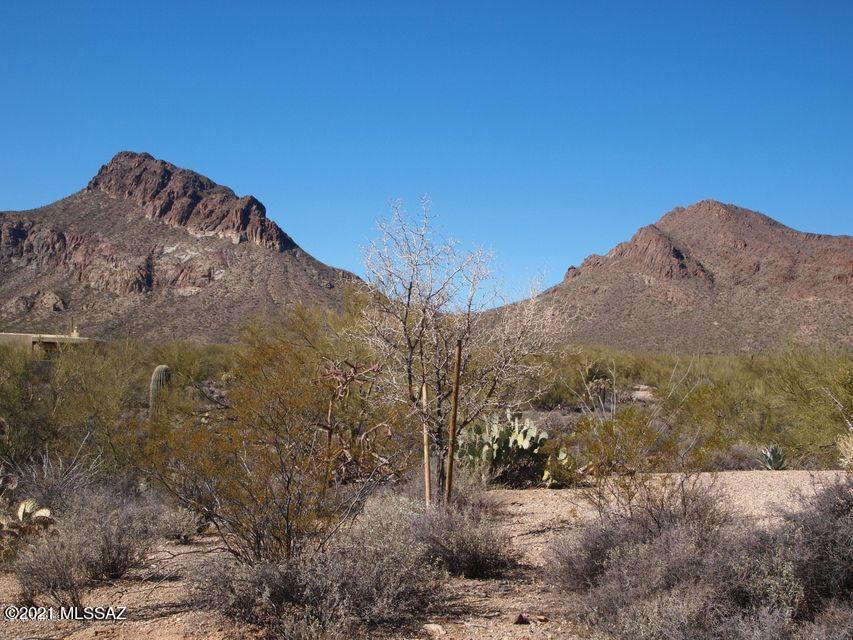 This lovely lot in Tucson Estates offers you sunsets over lush desert common area with views of Golden Gate Mtn. in the back. In the front the saguaro- studded Tucson Mtn. Park Preserve, just steps away, beckons for hiking, birding, or just enjoying the view. Community amenities include pickle ball, tennis, bocce courts, volleyball, year round heated pool and spa, active rec center with many yearly events and clubs. This beautiful lot is priced to sell! Schedule your showing today!