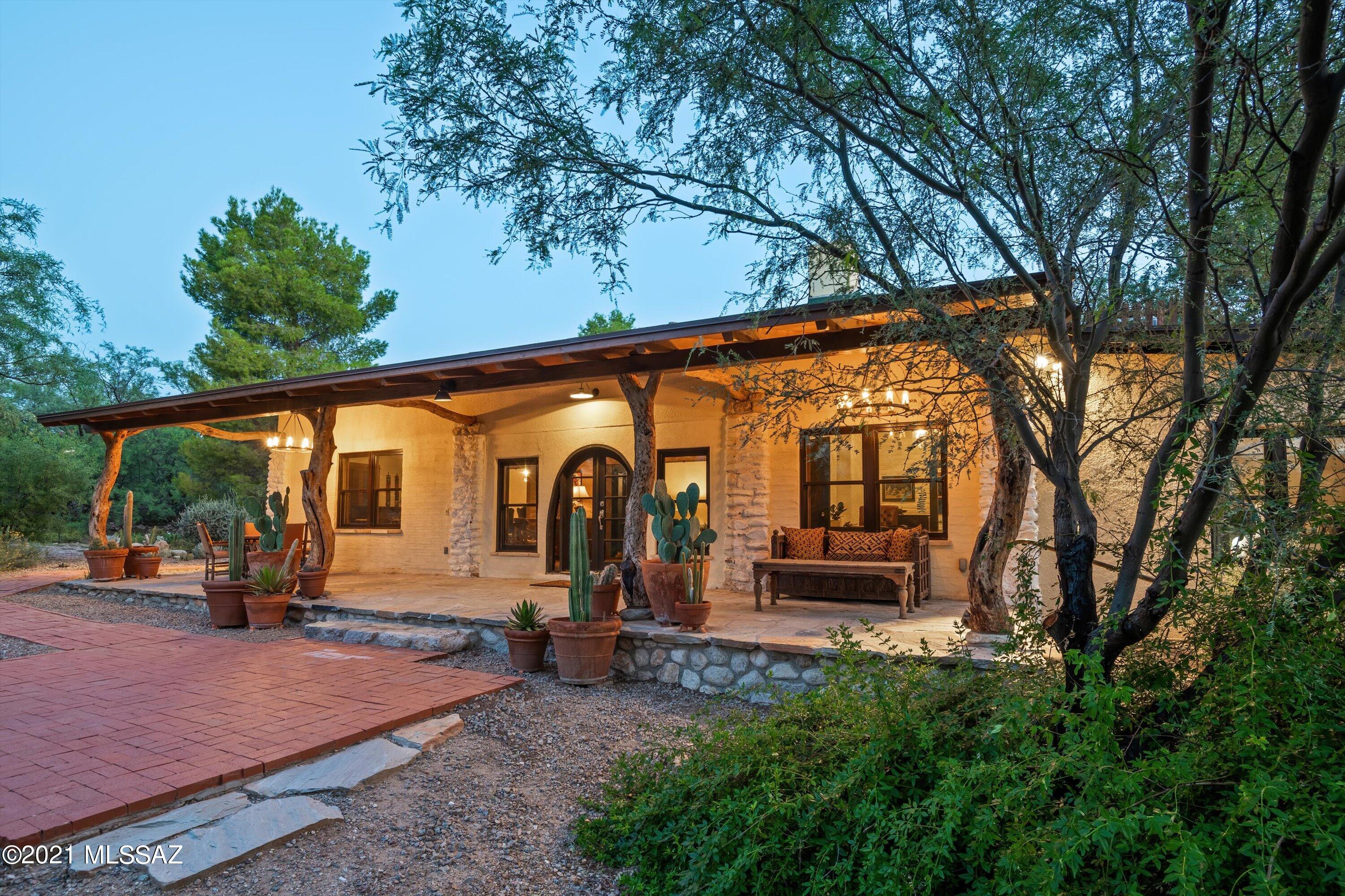 Own a piece of Tucson history! This beautiful 3 bed/3 bath historic ranch home sits secluded at the base of Sabino Canyon. Built in 1917, the home has been meticulously renovated & restored to meet the standards of the most discerning. Nearly 15 amazing acres, Sabino Ranch is a paradise to be explored. Walk through the mature trees & down to Sabino Creek as it runs across the property. In addition to the main house, you will find a 2 bed/1bath adobe guesthouse, a large adobe shop/garage with an office & covered carport. Take in the views of the Catalina Mountains from the pool & spa, which has its own pool house. The stables have plenty of storage with two covered paddocks & the tack room is an inviting space to lounge in after riding. Just up the hill is a huge arena/turnout & round pen. The Sabino Ranch is a must see! Breathtaking views of the Catalina Mountains across the property. A beautiful organic vegetable/flower garden is tucked behind the stables. The homestead was built in 1917 by Charles DeBaud, one of the pioneer ranch owners.  Along with the renovations and restoration of all ranch buildings by Means Design and Building Corporation, Eric Means's work includes facilitating phase two of the San Xaviers conservation project. The interior decor was designed by Christy Martin whose work at Sabino Ranch was featured in March 2011 Arizona Opera League's Home Tour. Jeffrey Trent of Landscape & Living Environments is the designer who has overseen the landscape & garden for over 20 years. His vision & execution have won multiple awards from Sunset Magazine Western Garden and Design. Each detail, inside & out, has been conceived & executed to an impeccable standard. 
*Please see the historic write-up of Sabino Ranch in the documents.*