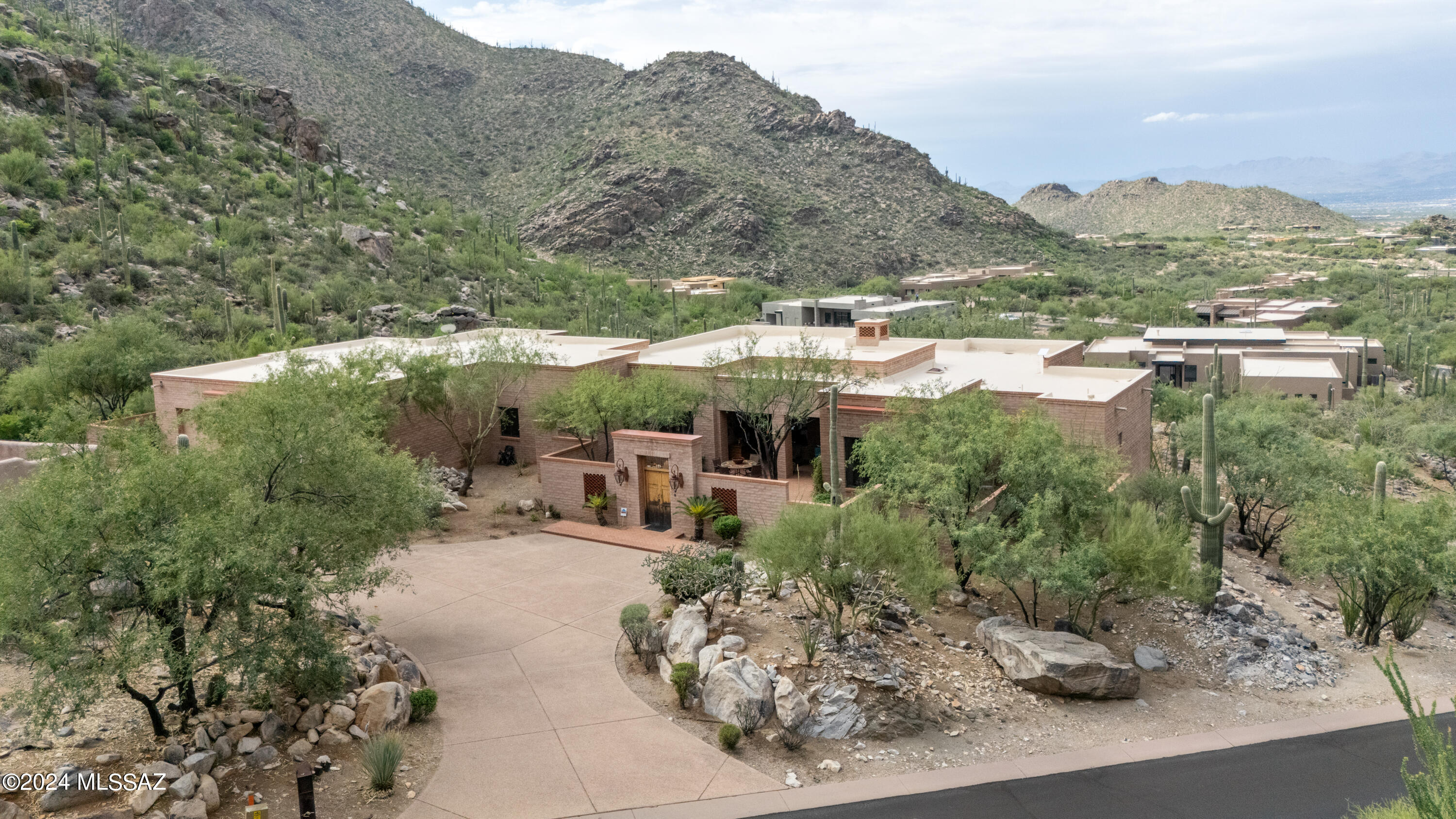Nestled against the Tortolita Mtns, this 3741 sq ft forever private sited dream home, epitomizes comfortable, casual and peaceful elegance in the exclusive gated community of Canyon Pass at Dove Mountain, The views out every window are spectacular.  Oversized rooms compliment the owners wing as well as the 3 bedroom guest wing. A well designed brick paved courtyard greets you at the front door and, as you pass through the house to the back patio, a private pool and spa creates an oasis of leisure and tranquility. A newly epoxied 3 car oversized garage to complement this most wonderful home is an added bonus,
Ritz Carlton, Gallery and The Highlands golf courses minutes away.