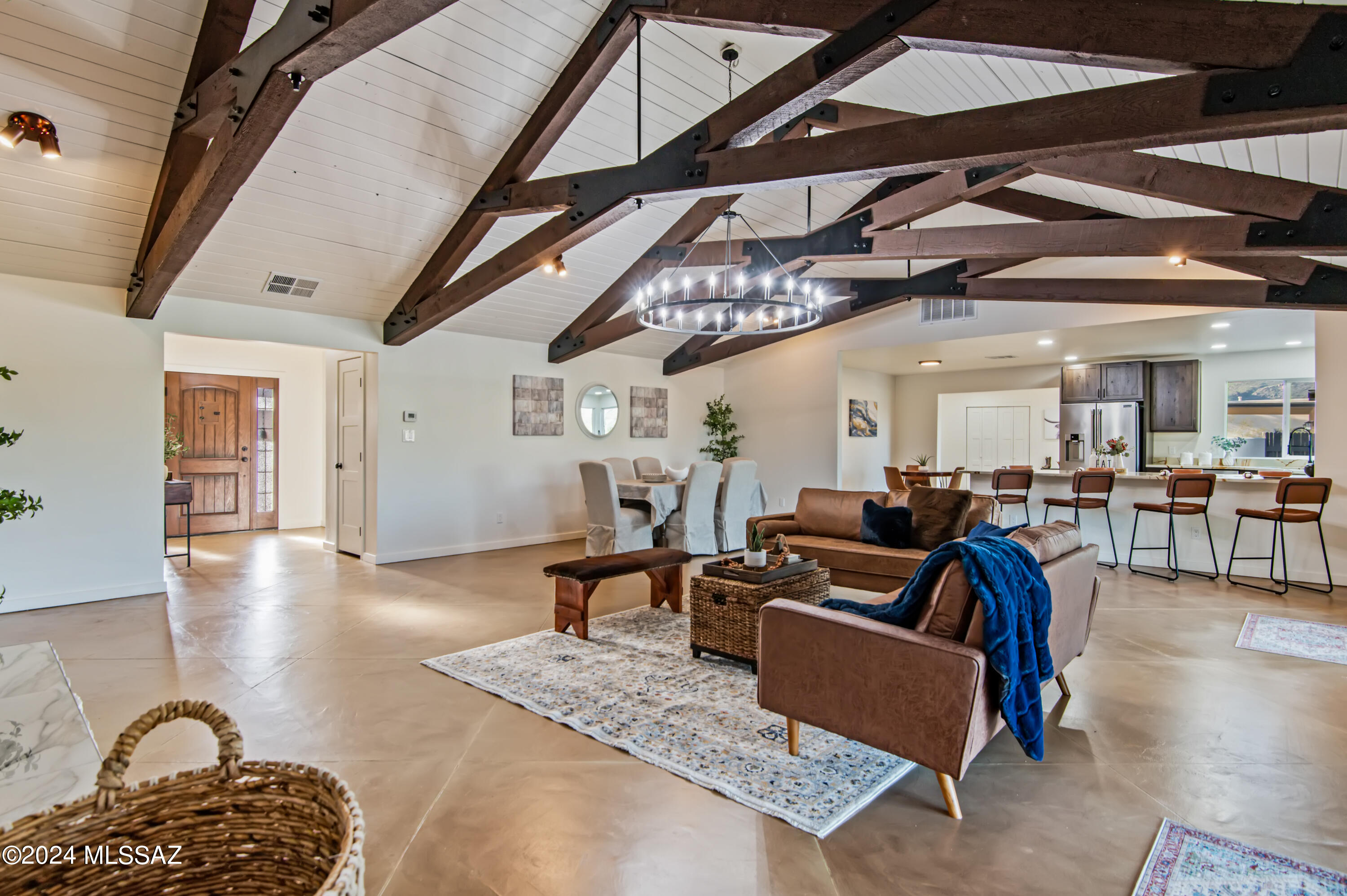 Discover a beautifully renovated home where rustic charm meets modern sophistication. The main house features a stunning kitchen with new rustic cabinets, Roma Imperiale Quartzite countertops, and top-of-the-line Thor appliances. Inside, enjoy fresh paint, elegant rubbed oil bronze fixtures, a grand chandelier alongside a stunning stacked stone fireplace and a spiral staircase. Luxurious bathrooms offer updated vanities, sinks, and decorative tiles. The exterior highlights new paint, a freshly updated pool, and low-maintenance landscaping. The guest quarters mirror the main house's style with a newly equipped kitchen, modern fixtures, and a stylish bathroom. This property combines timeless elegance with contemporary comfort, creating an ideal retreat for both you and your guests. Agent owner.