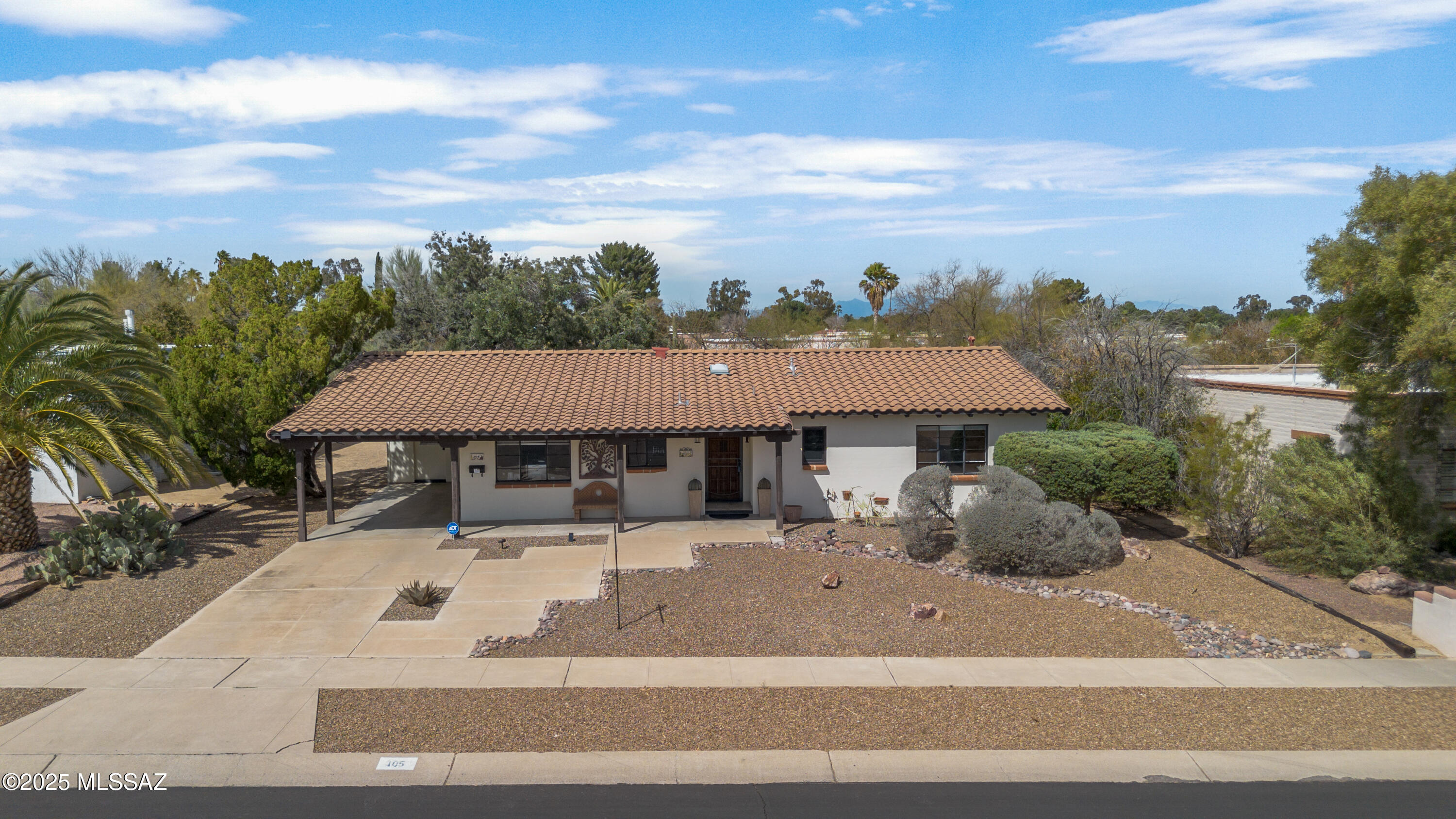 Experience Arizona living at its finest in this charming two-bedrooms, two-bathroom home perfectly positioned with stunning mountain and golf course views right across from your kitchen, dining room windows, and front covered patio.  The thoughtfully designed layout features porcelain tile throughout common area and plush carpeting in the bedrooms, creating a seamless blend of style and comfort.

The heart of this home showcases a well-appointed kitchen with a convenient island and breakfast bar, flowing naturally into a formal dining area.  The adjacent living room opens to a private backyard, complete with covered patios both front and back-perfect for enjoying Arizona 's legendary outdoor lifestyle.

The primary bedroom offers a modern shower and walk-in closet, while the guest bathroom features a practical tub/shower combination.  This home's location is simply unbeatable, with easy access to Safeway and other essential amenities, including shopping centers and restaurants.

Peace of mind comes standard with this property, thanks to a transferable home warranty thats been paid through June of 2028.  Whether you are seeking a permanent residence or a seasonal retreat, this Green Valley gem delivers the perfect blend of comfort and convenience.

The views, strategic location, and well-maintained features make this property an exceptional find in one of Arizona's most desirable communities.  Don't miss the opportunity to make this inviting residence your new home-schedule you viewing today.