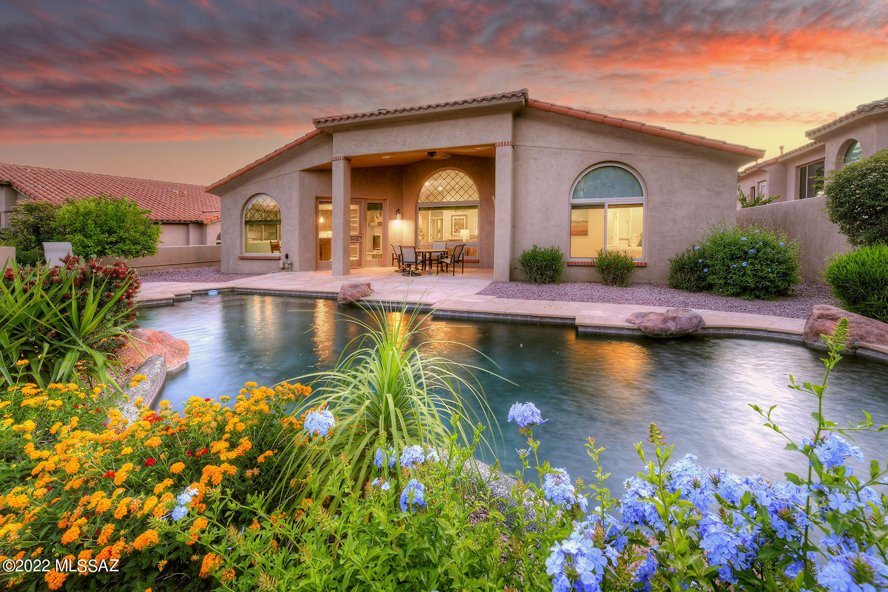 Sellers will consider offers between $995,000 and $1,100,000. This stunningly remodeled, 2,286 sq. ft. all-masonry stucco home, built by David Baird, is nestled in prestigious, gated Ventana Country Club Estates. The 3-bedroom, 2-bath residence backs up to the golf course and offers golf course and unobstructed Catalina Mountain views. The home has been lovingly updated with no expense spared! Highlights include a spacious great room with a soaring beamed ceiling and a 2-way fireplace, designer-coordinated ceramic tile flooring, window coverings & plantation shutters, new cabinetry, granite counters, all new baths, showers, fixtures and so much more. The fabulous chef's kitchen provides new cabinetry, granite countertops, a wood countertop at the breakfast bar, and stainless steel appliances including a gas cook-top & a wine fridge. The generous primary bedroom offers a designer tub, dual vanities, and a walk-in closet with built-ins. The 3rd bedroom/office/den offers a closet and a Murphy bed. The beautiful back patio features a covered porch, flagstone pool decking, a pool/spa with a waterfall & boulder accents, and enviable views. Easy walk to the country club and exercise facilities. District 16 schools.