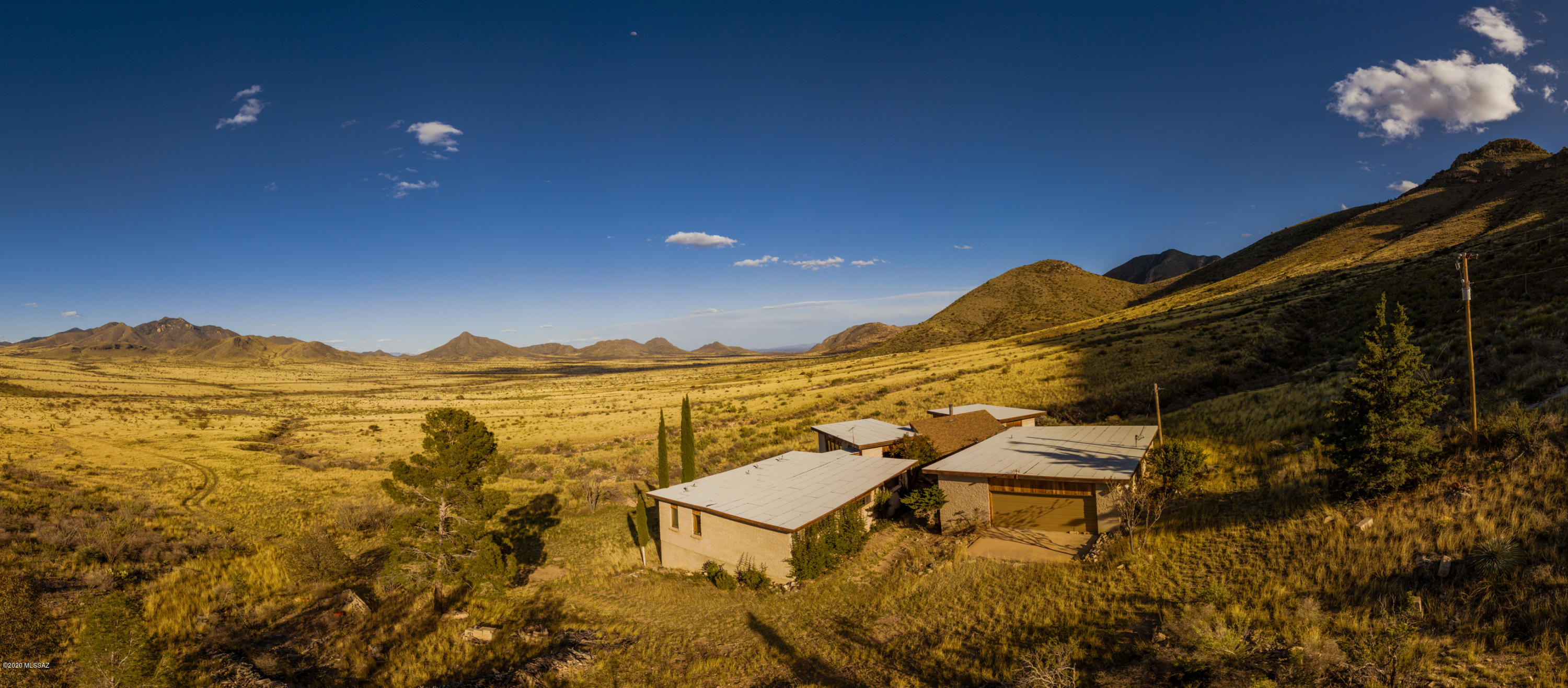 Welcome to this lovely 3 beds, 3 baths home in a 3049 sq ft area in Arizona. Stepping inside this lovely home gives the feel of owning a dream home. This house is for those that enjoy life in a quiet and serene environment. It sits in a 3,049 sq ft area in a landscape surrounding 196 acres of Mustang Mountain Ranch.
This brick home has plenty of space both inside and outside. No room in the house lacks in space from the living room, kitchen, dining, bedrooms to the 3 bathrooms.
From the entrance, you are met by hand-scraped mahogany wood flooring spreading across the living room, the balcony and the bedrooms. The kitchen and bathrooms are tiled for easy cleaning and to maintain a modern look. The living room has huge windows letting in ample natural light. The windows also provide a good view of the Mustang Ranch and the surrounding environment as well.
One of the most important rooms in a house is the kitchen. This kitchen has been remodeled with granite countertops making your cooking and cleaning as easy as possible. The kitchen is also spacious with multiple storage cabinets to help you unclutter the kitchen and evenly organize all your kitchen supplies. The kitchen also has updated appliances including a large refrigerator huge enough to store months of supplies and keep them fresh.
Each of the three bedrooms have unique baths with fresh matching fixtures in each of them. The baths are well lit and all tiled as well. The spacious bedrooms all have spacious closets making clothes storage easier and helping keep the rooms tidy and uncluttered. The master bedroom has a window with amazing views of the ranch and the upper windows provide ample amount of light in the room. All the bedrooms are also naturally lit reducing your electricity usage during the day.
When we talk of exclusion, quiet, peace and calm, this property excels. Its entrance has a driveway from the highway leading to the main door excluding you from the noise on the road. Wake up from the sound of birds chirping and tweeting around you and not the sounds of noise and blaring horns like in the city. Think of a home where fresh air is in plenty with zero pollution and noises.
This property is ready for viewing and you can simply email or call us to schedule a viewing.