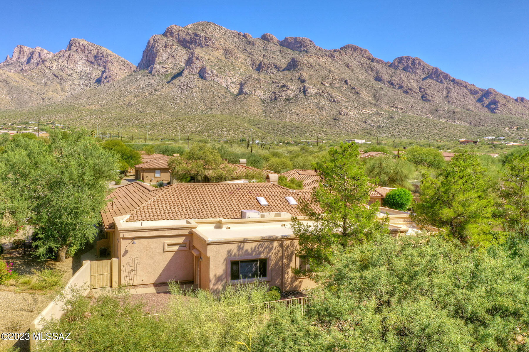 -Wonderful home on cul de sac lot in gated Sunstone Estates!  Fabulous home for entertaining! Very spacious rooms-Many custom features-
Formal living room has a gas fire place & built in niches with STUNNING views of Pusch Ridge!  Cooks will appreciate the well laid out kitchen with quartz counters, tons of cabinet space, double ovens, buffet serving area, walk in pantry, eat in area as well as breakfast bar.  The formal dining room seats 8-10
people.  Amazing game room features a full bar with bar stools, lighted cabinetry and various, comfortable seating areas!  Luxurious primary bedroom has a separate sitting/office area, 2 walk in closets & mountain views!  Remodeled bath has a garden tub, walk in shower (Click on MORE to continue) Two extra bedrooms large enough for king size beds and excellent closet space share a Jack & Jill 3/4 bath which has been remodeled.
Private backyard with covered porch, patio area with mountain views, citrus trees and plantings.  There is space in the yard for further development such as a play area, vegetable garden or more seating area.  Incredible tandem garage has tons of storage, a work bench and room for four cars!  Beautifully maintained and ready for a new owner!  Gated community with pool and spa which is within easy access to this home!ASSESSORS OFFICE HAS INCORRECT SQUARE FOOTAGE (4488). IT HAS NOW BEEN CORRECTED TO 3950. 2024 TAXES SHOULD BE REFLECTED IN LOWER TAXES.