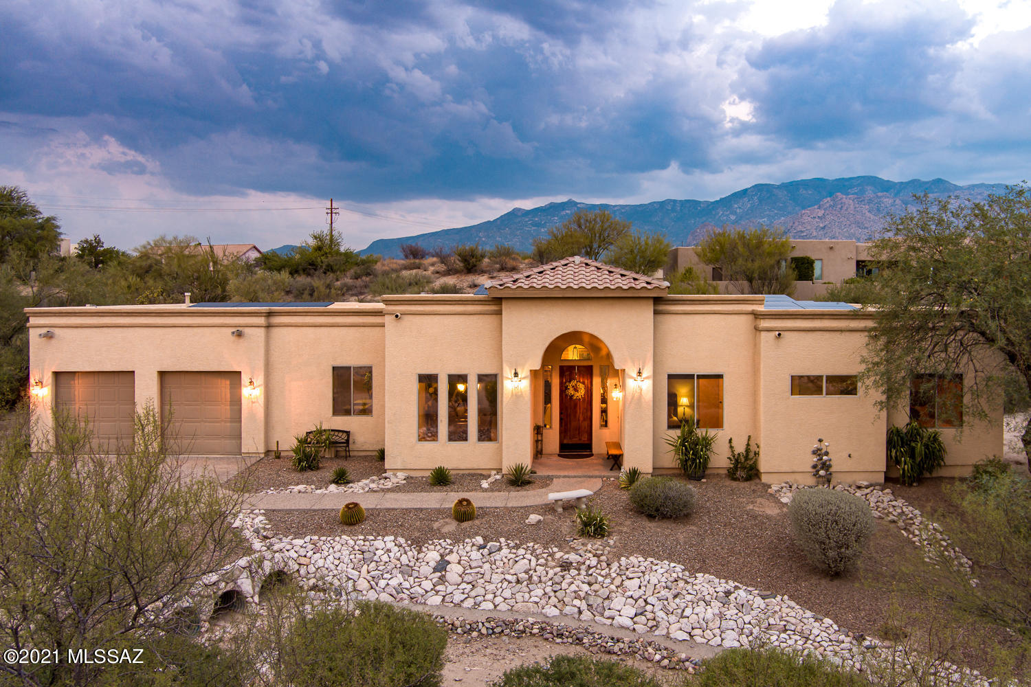 Gorgeous custom home with views of Pusch Ridge Mountains! Located in the Gated Community of Palisades Point in Oro Valley. With 2785 sq ft of living space this home has 3 bedrooms, 3 bathrooms, & den/office that can easily be converted to 4th bedroom. Spacious kitchen with plenty of cabinet space, desk, stainless steel appliances, chiseled-edge granite counter tops & dining area. Beautiful tile flooring in all the right places & stacked stone fireplace in living room. Primary bathroom with two separate vanities, walk in closets, jetted tub and walk-in shower. Enjoy the backyard with beautiful views, large covered patio, built in BBQ grill, turf, & sparkling pool & spa, great for relaxing & entertaining. Call Agent to see this home today!