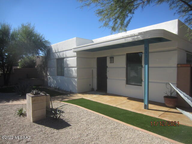 This amazing 3 bdrm 2 ba home with Art Deco styling throughout has been fully remodeled and it shows like a model. Some of the wonderful amenities include new interior paint, new tile floors throughout, new kitchen cabinets in the Art Deco style, new stainless steel kitchen appliances, new water heater & AC unit, fully remodeled bathrooms with beautiful tub & shower tile work, new lighting fixtures & recess can lighting, new window coverings, & more. This home is located on a corner lot, it has a wonderful back porch with built in seating, a 600 sq. ft. garage, the front & rear yards are enclosed with patio walls, and  the grounds are beautifully landscape.  This home has a convenient location that is just a short commute to the U of A, downtown, shopping, & major employment centers.