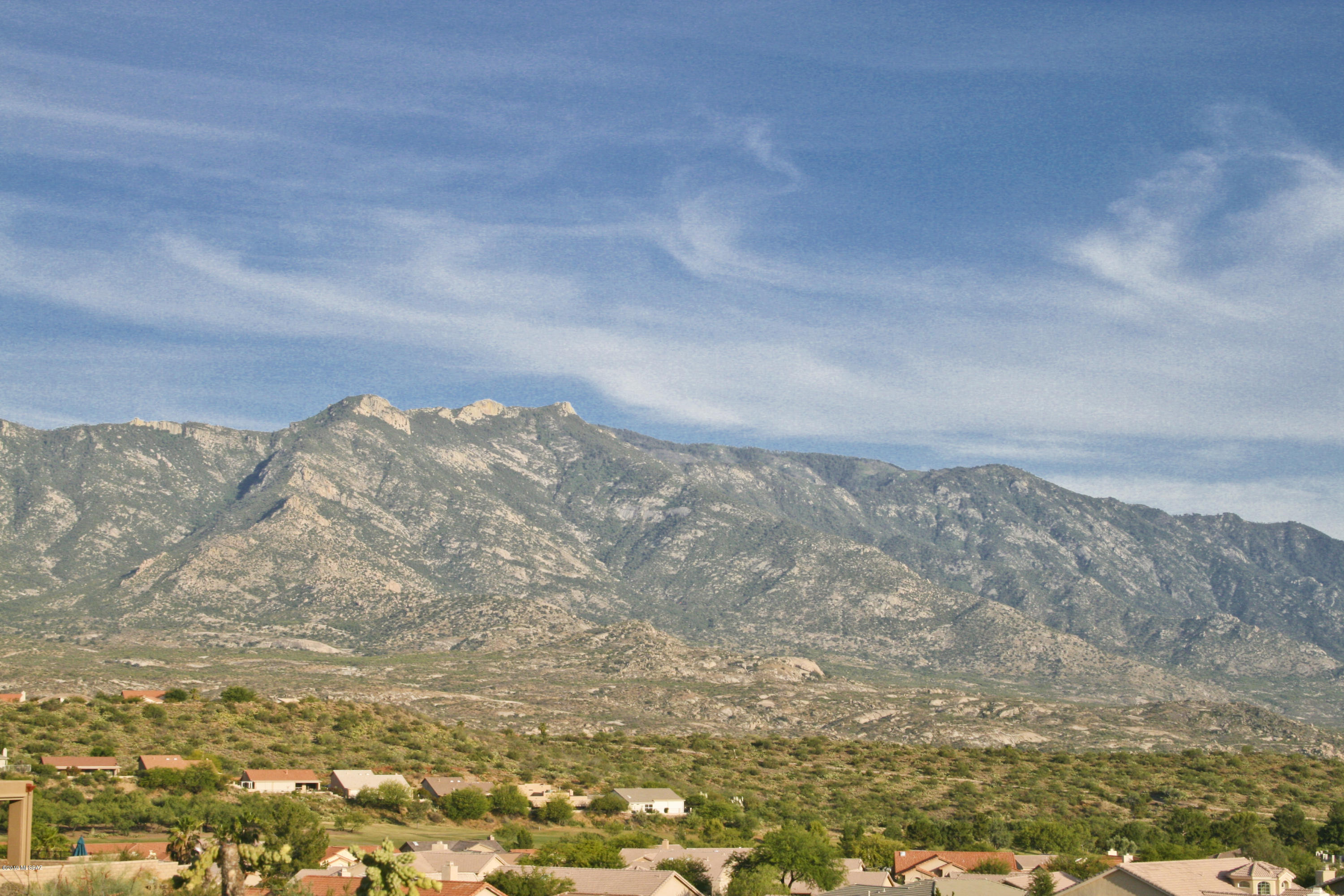 Exceptional Catalina Mountain views await at this custom home site with NO HOA! Design a home to make great use of the perched location and enjoy incredible vistas every day that are not only stunning but expansive. This gently sloping lot can accommodate most builder floor plans with fairly minimal site preparation or custom design your own home. Once site prep is done a simple patio wall will block out low lying rooftops of neighboring Saddlebrooke while preserving those astonishing mountain views. Contact listing agent for a personal tour of lot.