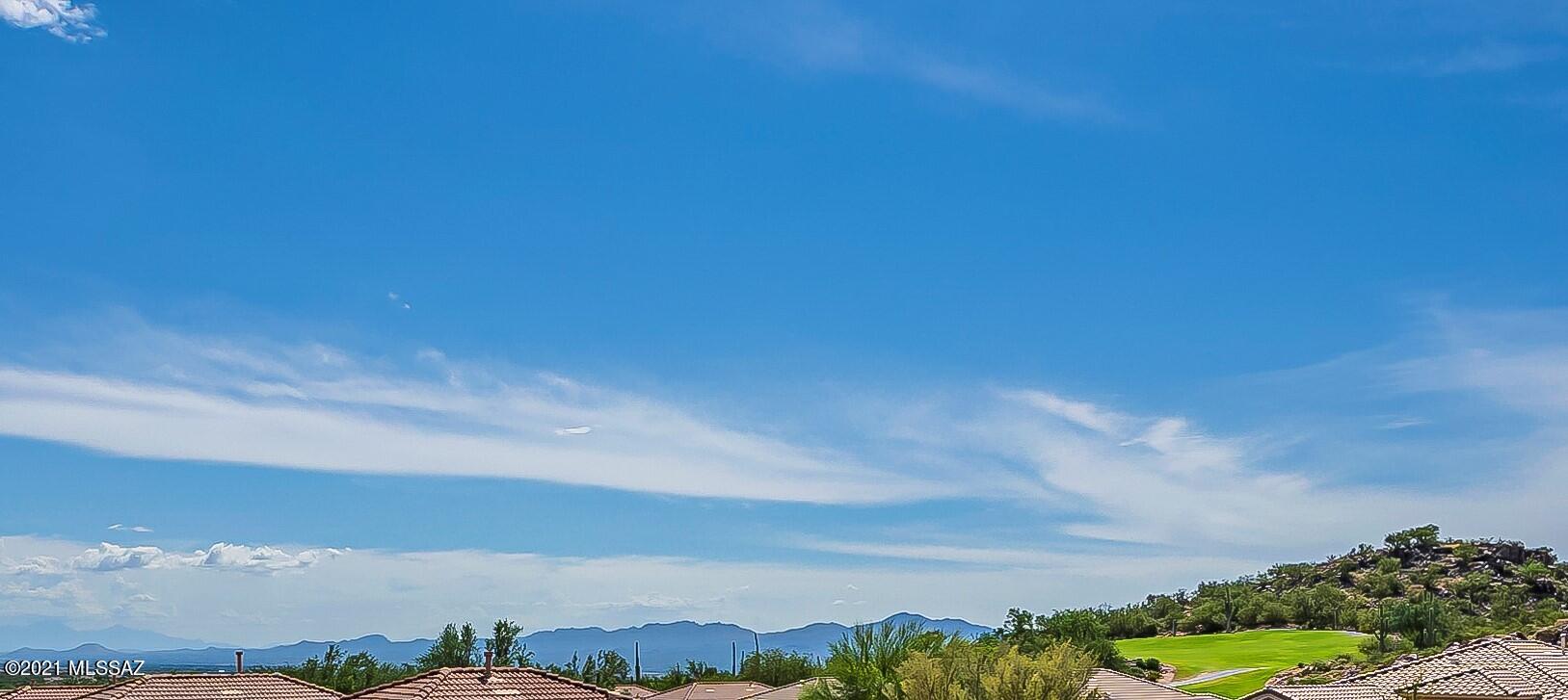 This home has it all, views, privacy, amenities, golf all in the highly sought after gated community of Heritage Highlands in Dove Mountain. This Portland floor plan is open an airy featuring an updated kitchen with new appliances, kitchen island, eat in breakfast area just off the family room. The HVAC, Water heater, water softener, kitchen lighting and irrigation are all newer. The home sits on a corner lot with views of the golf course, city and mountains. The backyard has a paver covered patio with new remote controlled shades. Inside you have 2 bedrooms and an open office/den with plantation shutters throughout. Come enjoy the lifestyle you deserve in Dove Mountain.