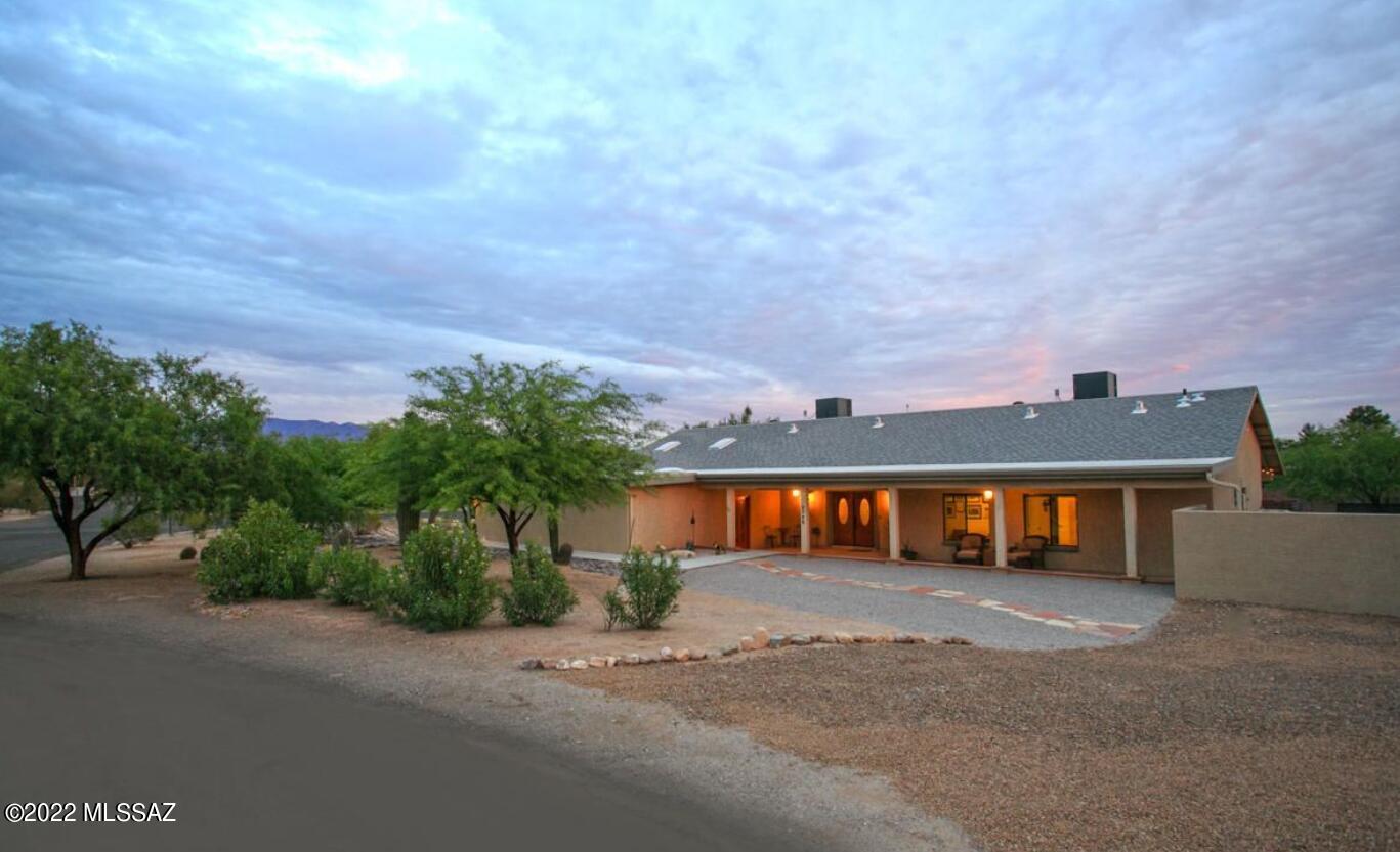 Complete Remodel from Studs Up in 2012! 4 bedroom 3 bath home has a modern open great room floor plan with soaring, vaulted ceilings and large double master suites in a split bedroom floor plan. A huge bonus room with custom top of the line built-ins. Incredible gourmet kitchen with granite counters tons of cabinet space, stainless steel appliances. Tons of storage space inside and out. Large walk in laundry room. Gutter System and 865-Gallon Rainwater Harvesting Tank, Block Wall and Large Metal Gate for Access to Flat Mesquite Studded Property that is Perfect for RV Parking or Whatever You Can Imagine. 650 Square Foot 2-Car Garage. Back yard: Lovely pebble tech pool and shaded patio. Front yard deep and always shaded front porch. Quiet street home on cul-de-sac corner. Sit back and enjoy your Catalina mountain views. Well-Established Tanque Verde Valley Neighborhood that is Close to Everything--Popular McDonald Park, Mt. Lemmon, Saguaro Natl Park East, Great Restaurants and Coffee Shops, Bear Canyon Library, Grocery Store and Much More!