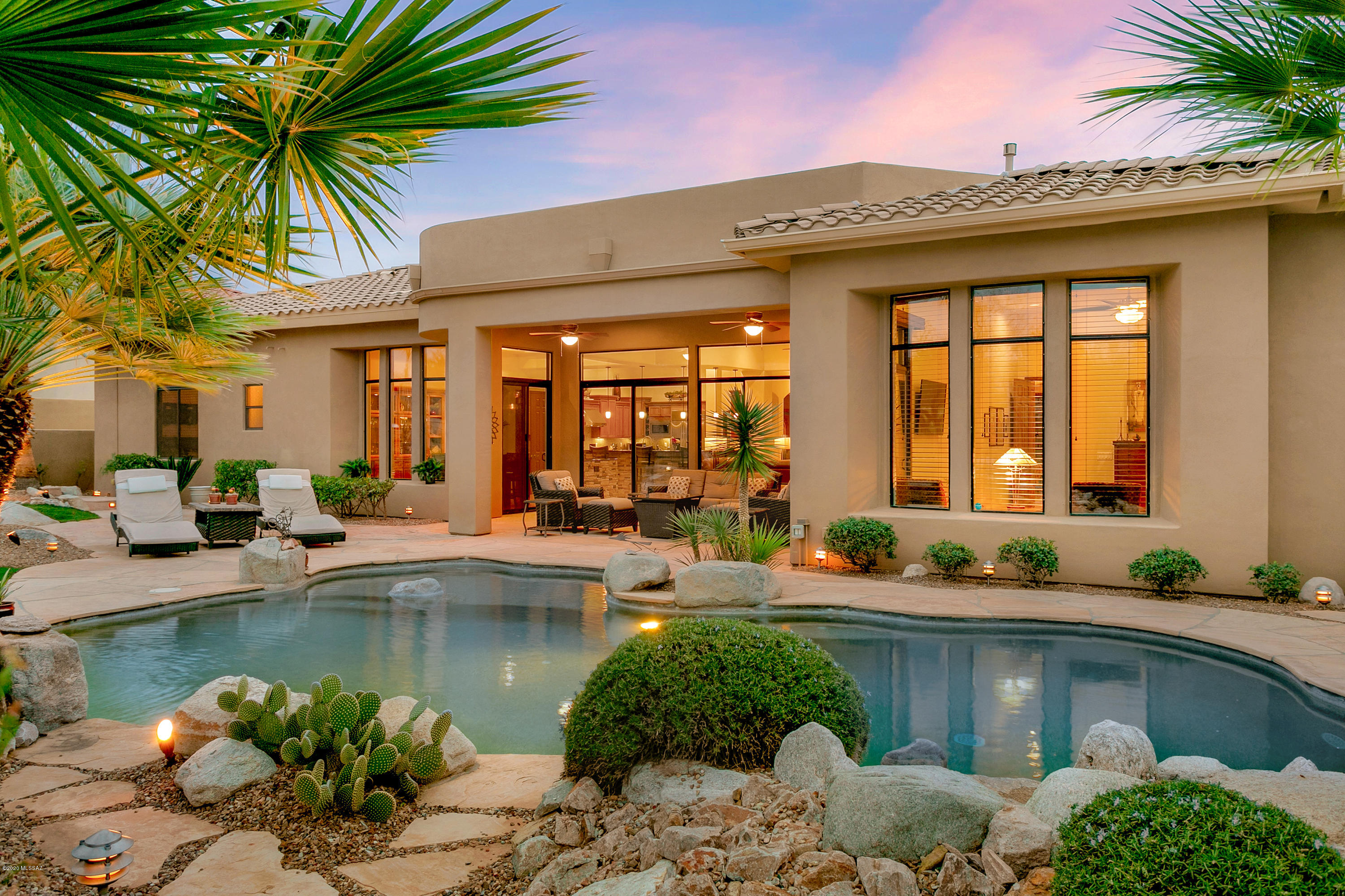 Absolutely gorgeous contemporary home located in 14-home gated Entrada in Rancho Vistoso. 3,779SF, 3BR/3½BA+den. Plus, casita w/BA. Great room design offers wall of stacked stone & gas FP. Gourmet kitchen featuring granite slab counters, alder cabinets, 20' curved breakfast bar & Chef's island w/prep sink, Stainless GE-Monogram Refrigerator, Gas Cooktop & Grill. 2 Ovens, Built-in Dining buffet. Casual dining nook has wine refrigerator w/glass cabinets.Formal dining area. Upgrades include: freshly painted interior walls, trim, and doors. 7.1 speaker surround sound in living room + much more! Large secondary BRs have En-suite BAs.3 car garage.Backyard desert oasis backs up to open space.Inviting sparkling pool, BBQ, covered patio.You will enjoy all the amenities of resort style living!
