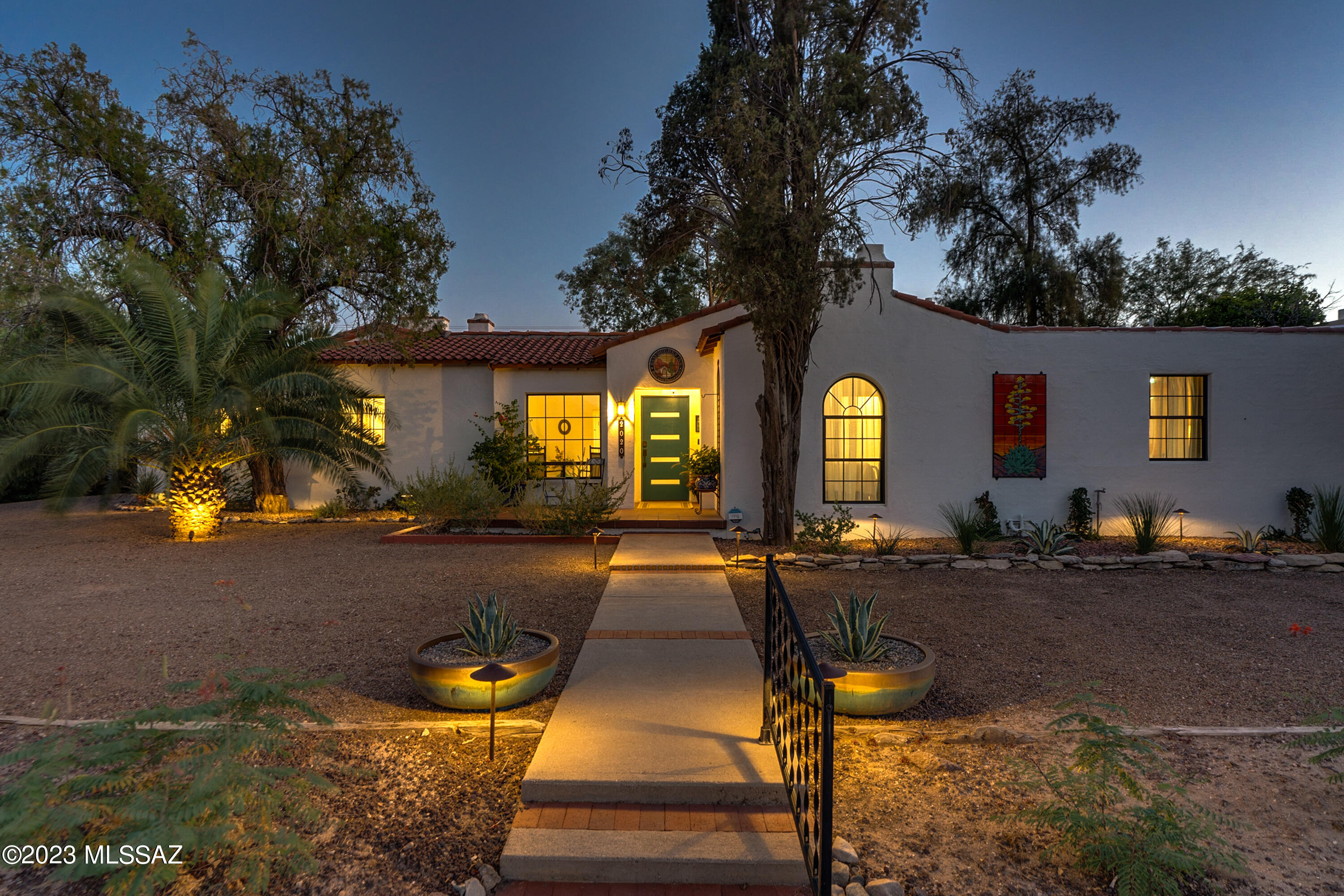 Impeccably restored, this historic masterpiece in the sought-after Sam Hughes neighborhood presents a stunning 4-bed, 4-ensuite bath main house & charming casita. The restoration showcases the preservation of original hardwood floors, timeless terrazzo tile, & fireplaces, alongside a new kitchen, new bathrooms, updated electrical & plumbing, & increased energy efficiency. Set on an expansive double lot, the property features meticulously landscaped gardens, providing a serene oasis in a prime central location. Every aspect of the restoration, from preserving architectural features to seamlessly integrating modern amenities, has been thoughtfully executed, ensuring a perfect marriage of history & contemporary comfort. Don't miss this rare chance to own a gorgeously restored Tucson gem!