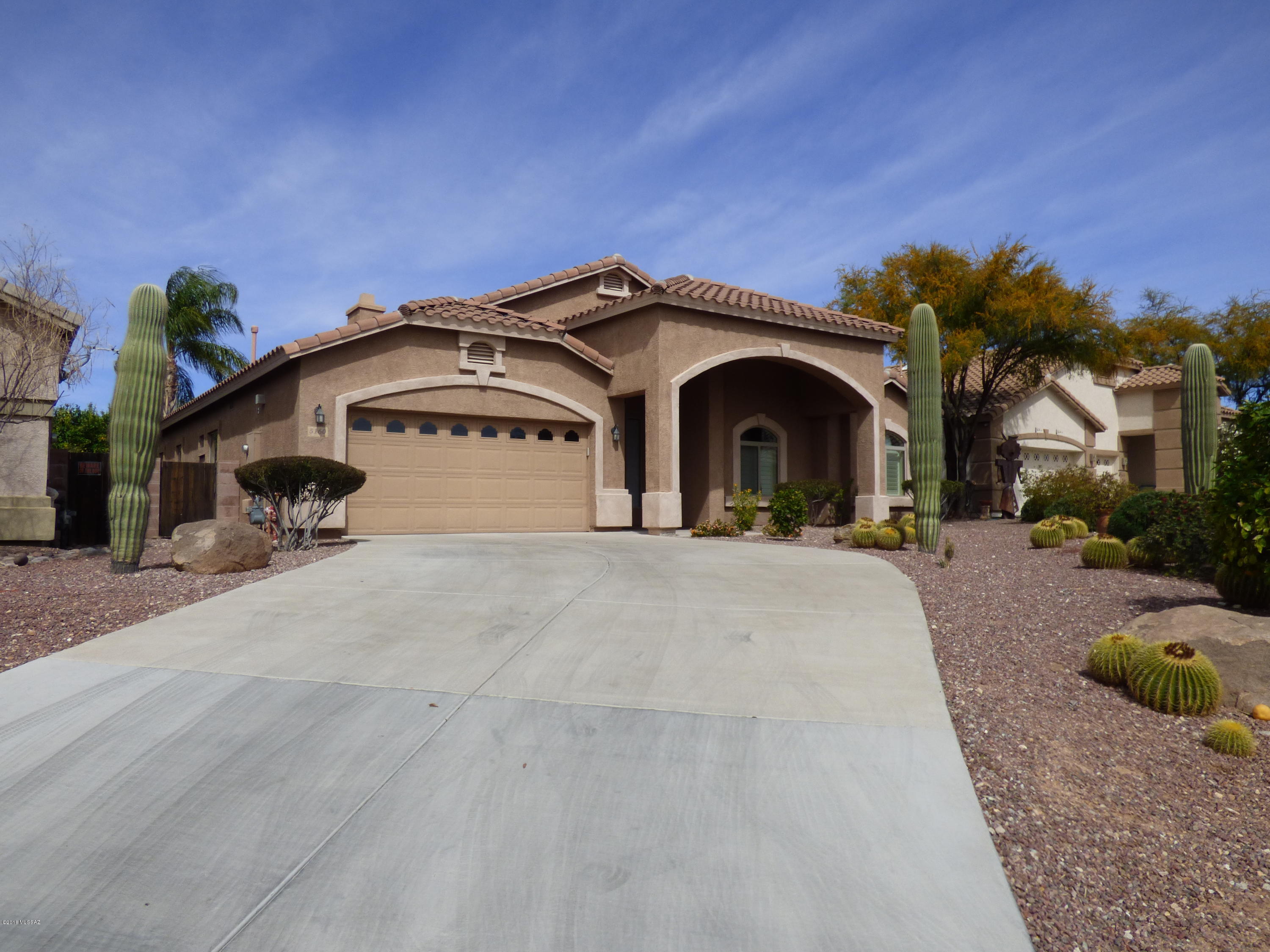 THIS BEAUTIFUL HOME IN A GATED COMMUNITY HAS MANY EXTRAS. LARGE KITCHEN WITH GRANITE COUNTERS, LAMINATE FLOORS, LARGE OPEN FLOOR PLAN, GAS FIREPLACE, CERAMIC TILE, LARGE PRIVATE BACKYARD WITH FRUIT TREES,  AND MANICURED LANDSCAPING. THIS IS A MUST SEE.