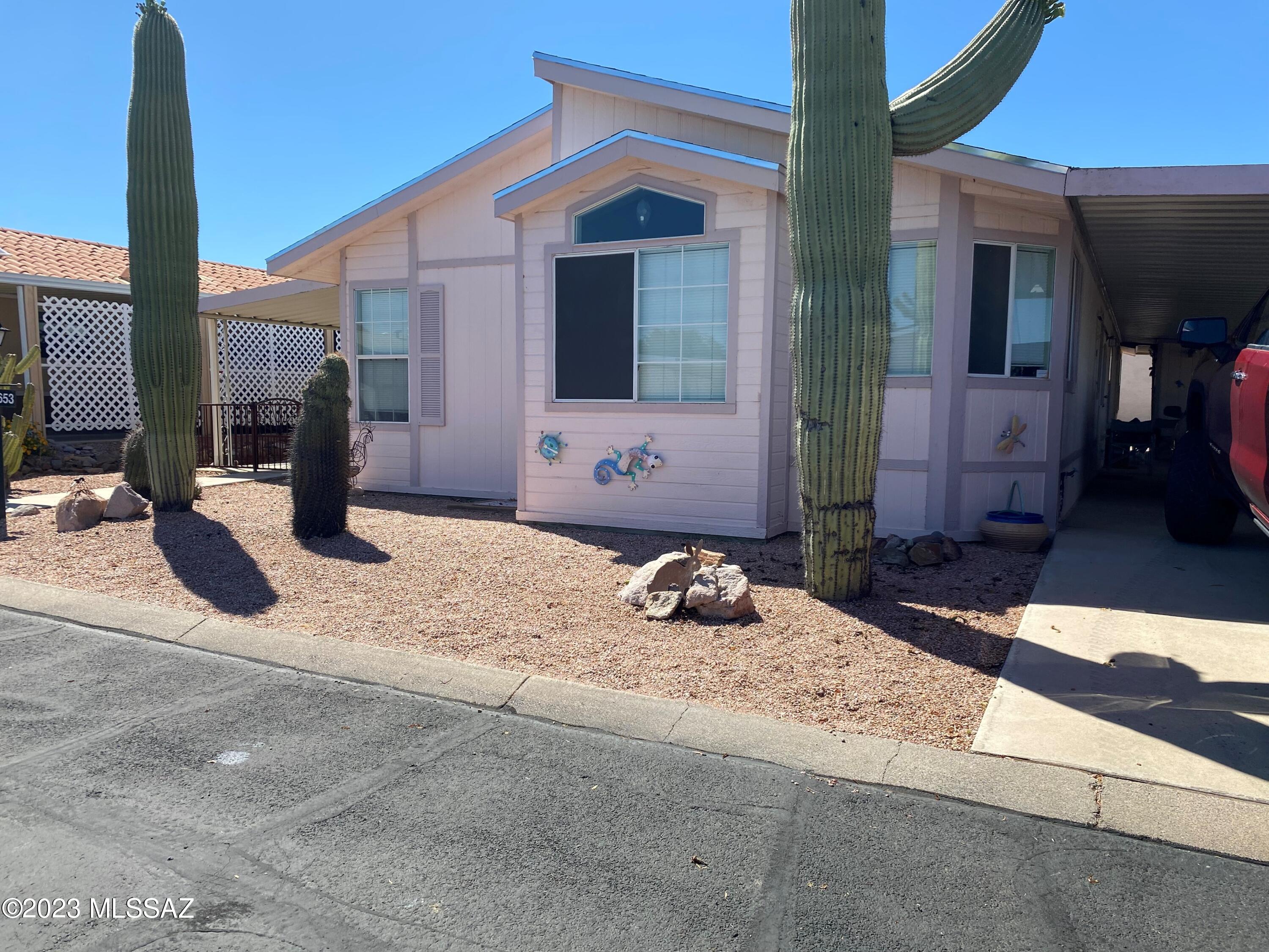 Beautiful retirement home/community.  This beautiful home has hard wood floors, outside work area/storage, a large front patio and is located on a corner lot.  This two bedroom two bath also has a very spacious den area for an office, library or reading room.  Copper Crest is a 55+ active adult community.  The community has a very large clubhouse, exercise rooms, library, pool, spa and many more amenities.  Beautifully located in the western outskirts of Tucson with many hiking, biking trails near the community.